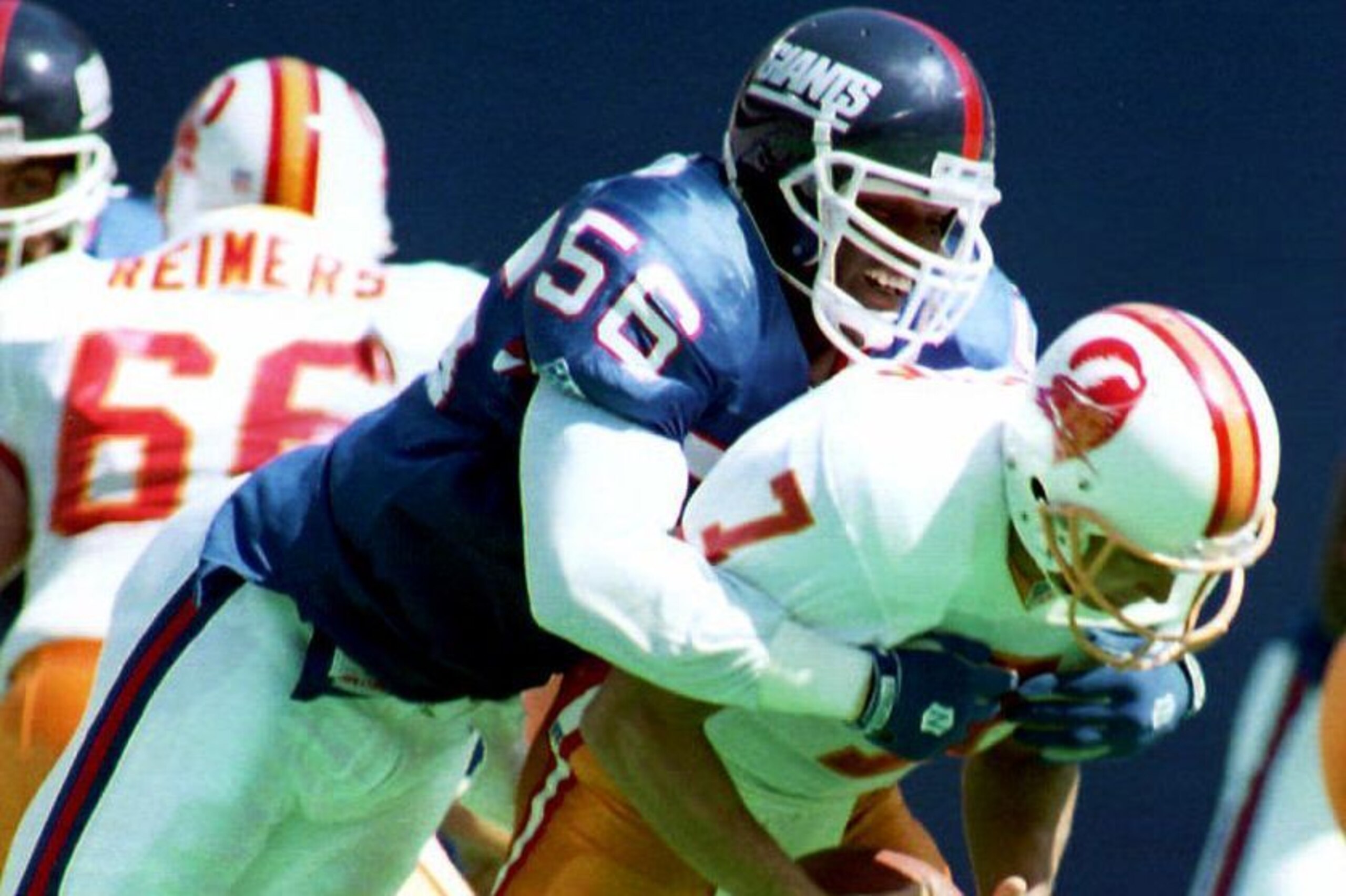 EAST RUTHERFORD, NJ - SEPTEMBER 12:  New York Giants linebacker Lawrence Taylor sacks Tampa Bay Buccaneers quarterback Craig Erickson during the second quarter 12 September 1993, in East Rutherford, New Jersey. The Giants won the game 23-7.  (Photo credit