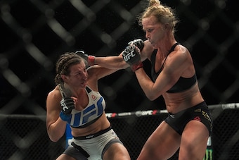 LAS VEGAS, NV - MARCH 5:   (R-L) Holly Holm exchanges punches with Miesha Tate during their women's bantamweight championship  bout during the UFC 196 in the MGM Grand Garden Arena on March 5, 2016 in Las Vegas, Nevada. (Photo by Brandon Magnus/Zuffa LLC/