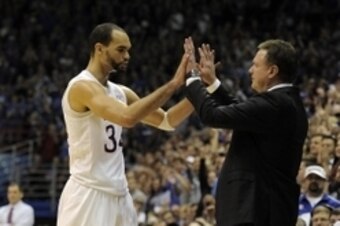 Mar 5, 2016; Lawrence, KS, USA; Kansas Jayhawks forward Perry Ellis (34) is congratulated by head coach Bill Self against the Iowa State Cyclones in the second half at Allen Fieldhouse. Kansas won the game 85-78. Mandatory Credit: John Rieger-USA TODAY Sp