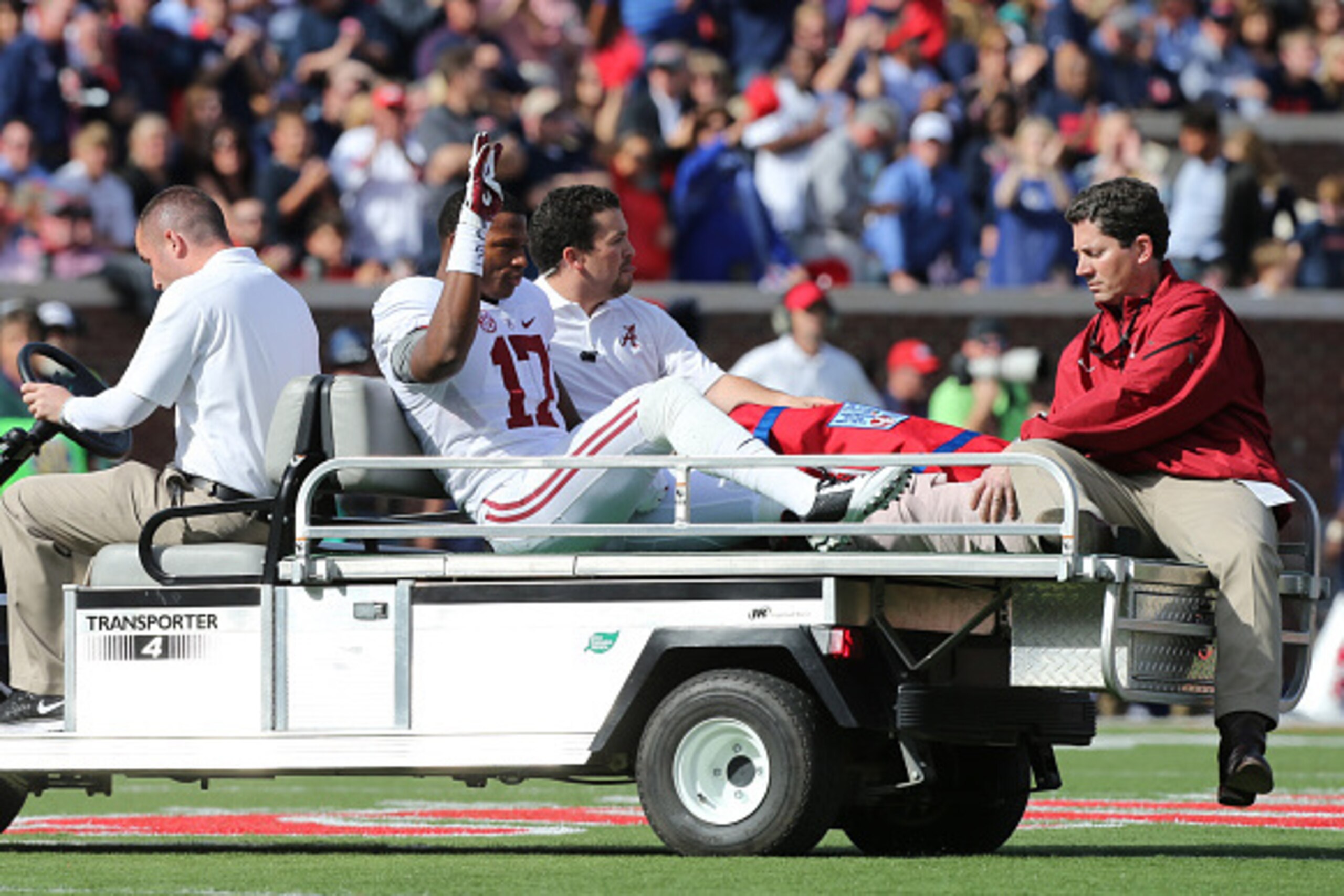 OXFORD, MS - OCTOBER 4: Kenyan Drake #17 of the Alabama Crimson Tide waves to the crowd after being carted off the field with an injury against the Ole Miss Rebels on October 4, 2014 at Vaught-Hemingway Stadium in Oxford, Mississippi. Mississippi beat Ala