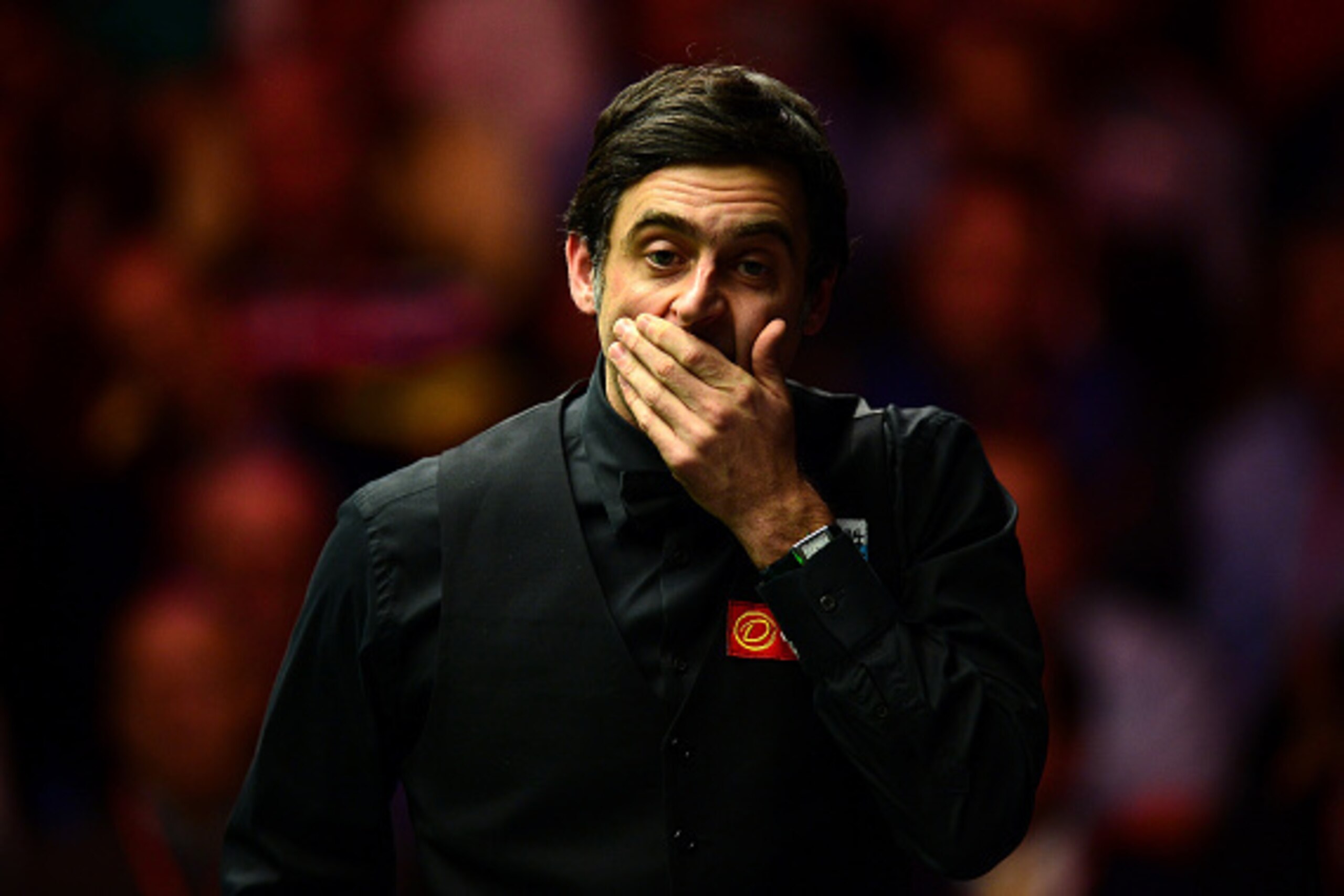 LONDON, ENGLAND - JANUARY 17:  Ronnie O'Sullivan reacts after fluking a pot to win the 9th frame during the Final match against Barry Hawkins of England during Day Eight of The Dafabet Masters at Alexandra Palace on January 17, 2016 in London, England.  (