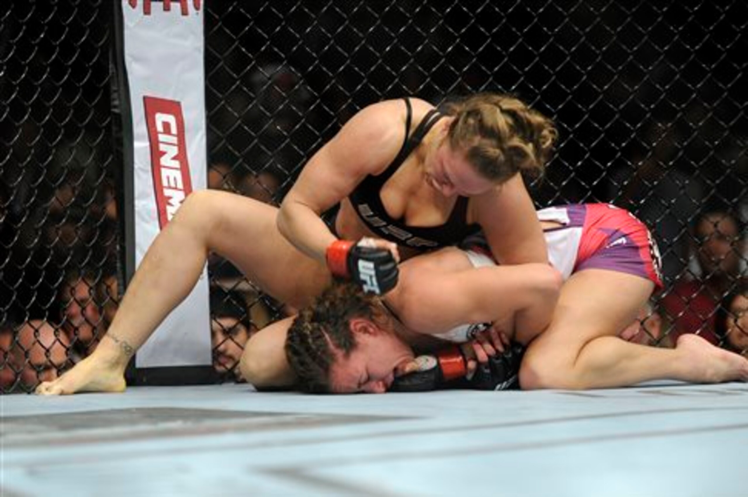 Rousey hammers Tate at UFC 168. Rousey hammers Tate at UFC 168.