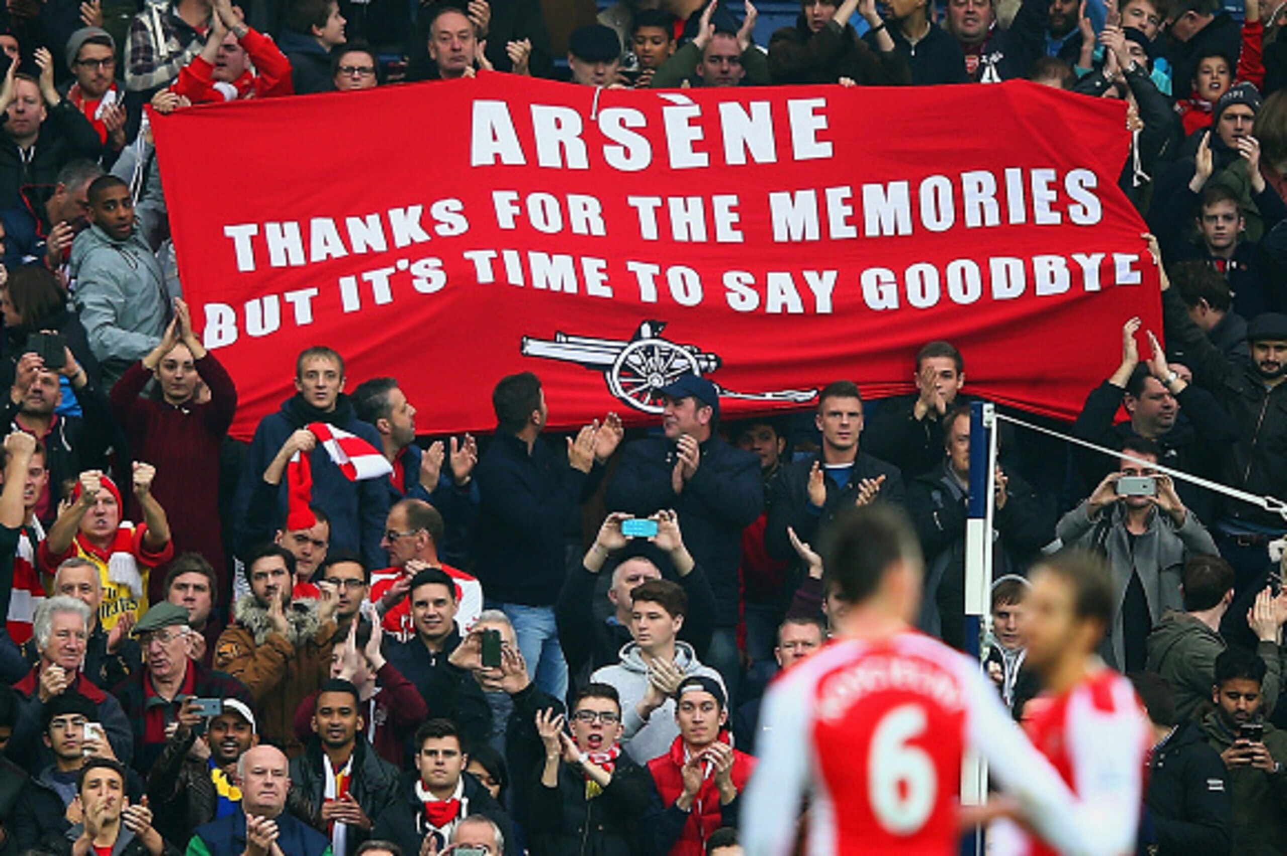 WEST BROMWICH, ENGLAND - NOVEMBER 29: (EDITORS NOTE: This is a retransmission of image #459708260 with an alternative crop) Arsenal fans hold up a banner for Arsene Wenger, manager of Arsenal during the Barclays Premier League match between West Bromw WEST BROMWICH, ENGLAND - NOVEMBER 29: (EDITORS NOTE: This is a retransmission of image #459708260 with an alternative crop) Arsenal fans hold up a banner for Arsene Wenger, manager of Arsenal during the Barclays Premier League match between West Bromw