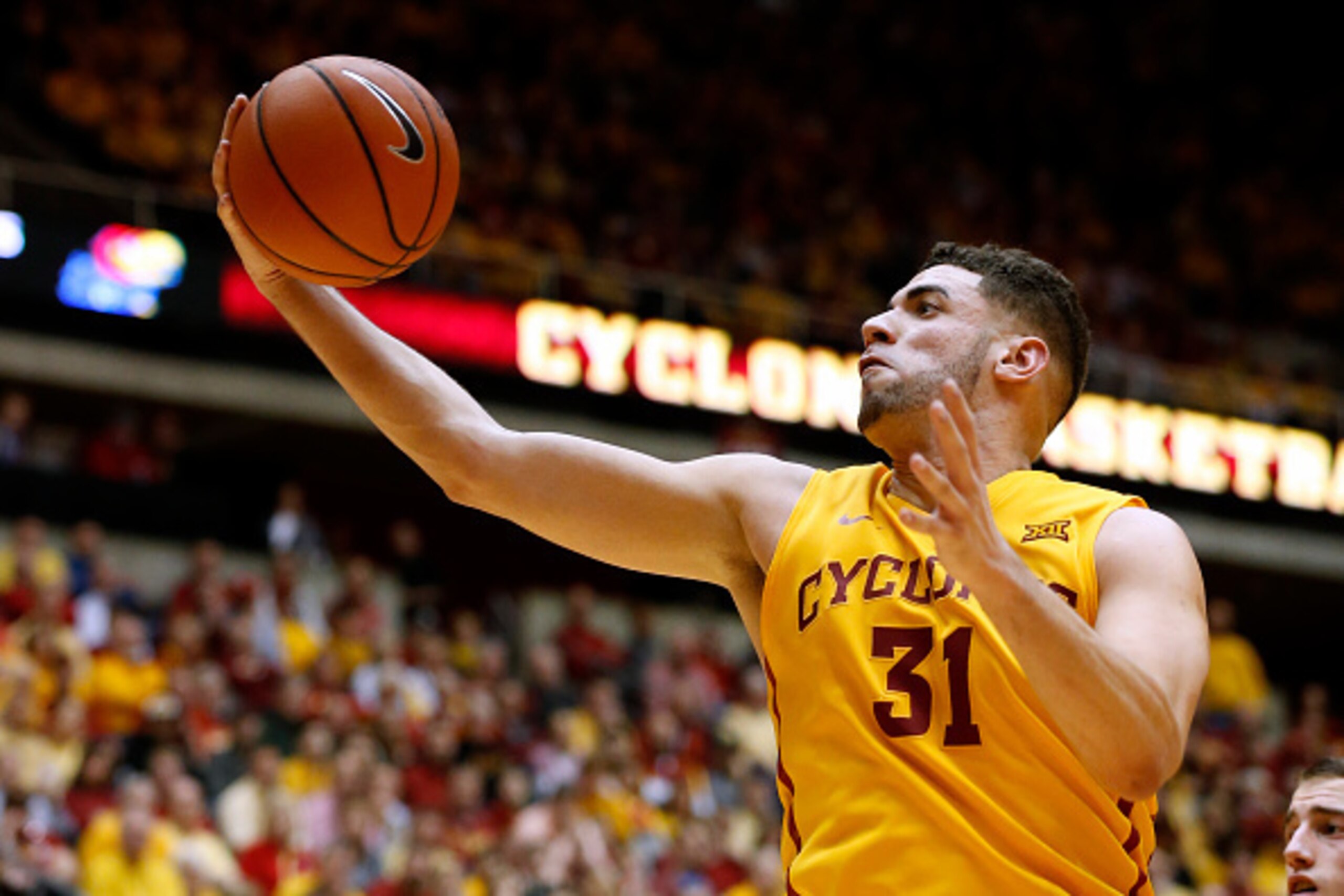 AMES, IA - JANUARY 25: Georges Niang #31 of the Iowa State Cyclones pulls in a rebound in the second half of play against the Kansas Jayhawks at Hilton Coliseum on January 25, 2016 in Ames, Iowa. The Iowa State Cyclones defeated Kansas 85-72. (Photo by Da