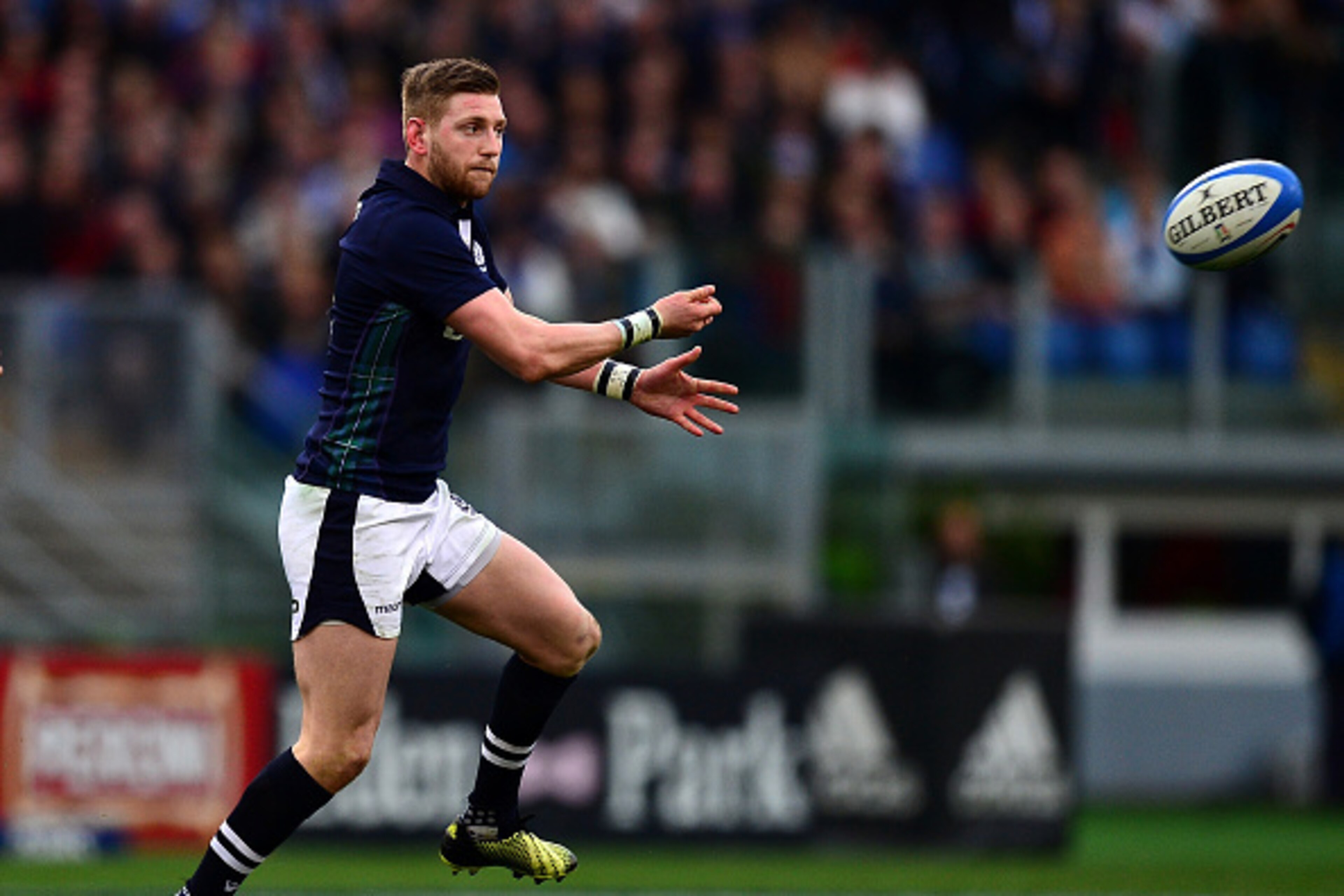 ROME, ITALY - FEBRUARY 27:  Finn Russell of Scotland releases a pass during the RBS Six Nations match between Italy and Scotland at Stadio Olimpico on February 27, 2016 in Rome, Italy.  (Photo by Dan Mullan/Getty Images)