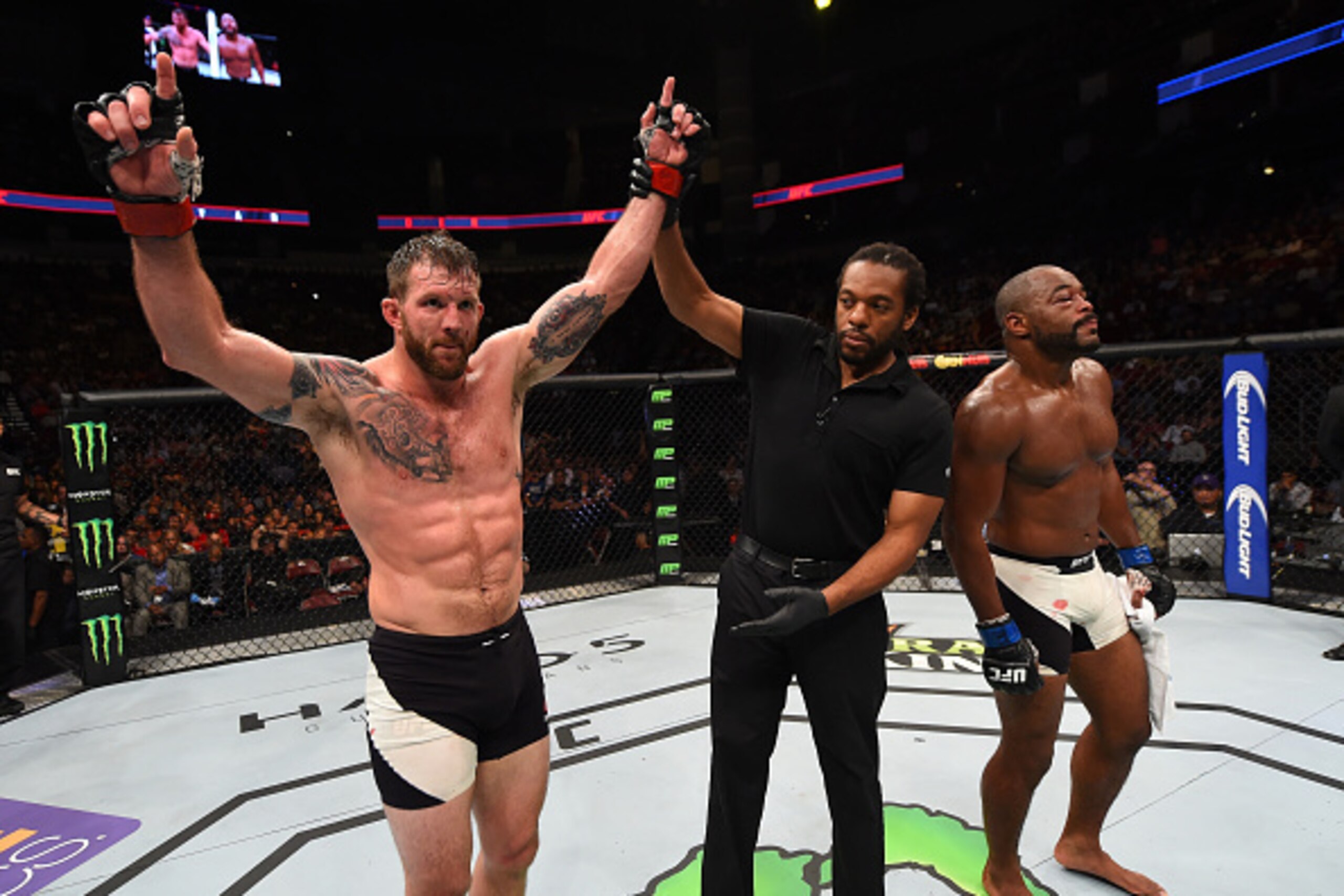 HOUSTON, TX - OCTOBER 03:  (L-R) Ryan Bader celebrates his victory over Rashad Evans in their light heavyweight bout during the UFC 192 event at the Toyota Center on October 3, 2015 in Houston, Texas. (Photo by Josh Hedges/Zuffa LLC/Zuffa LLC via Getty Im