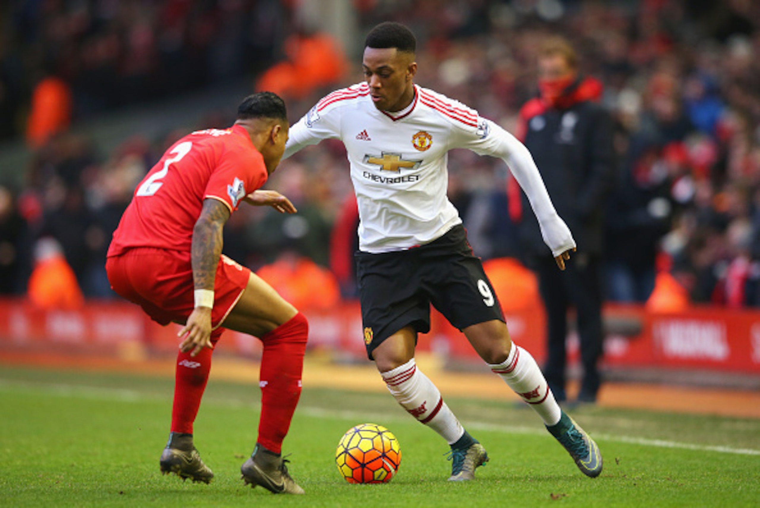 LIVERPOOL, ENGLAND - JANUARY 17: Anthony Martial of Manchester United takes on Nathaniel Clyne of Liverpool during the Barclays Premier League match between Liverpool and Manchester United at Anfield on January 17, 2016 in Liverpool, England.  (Photo by A