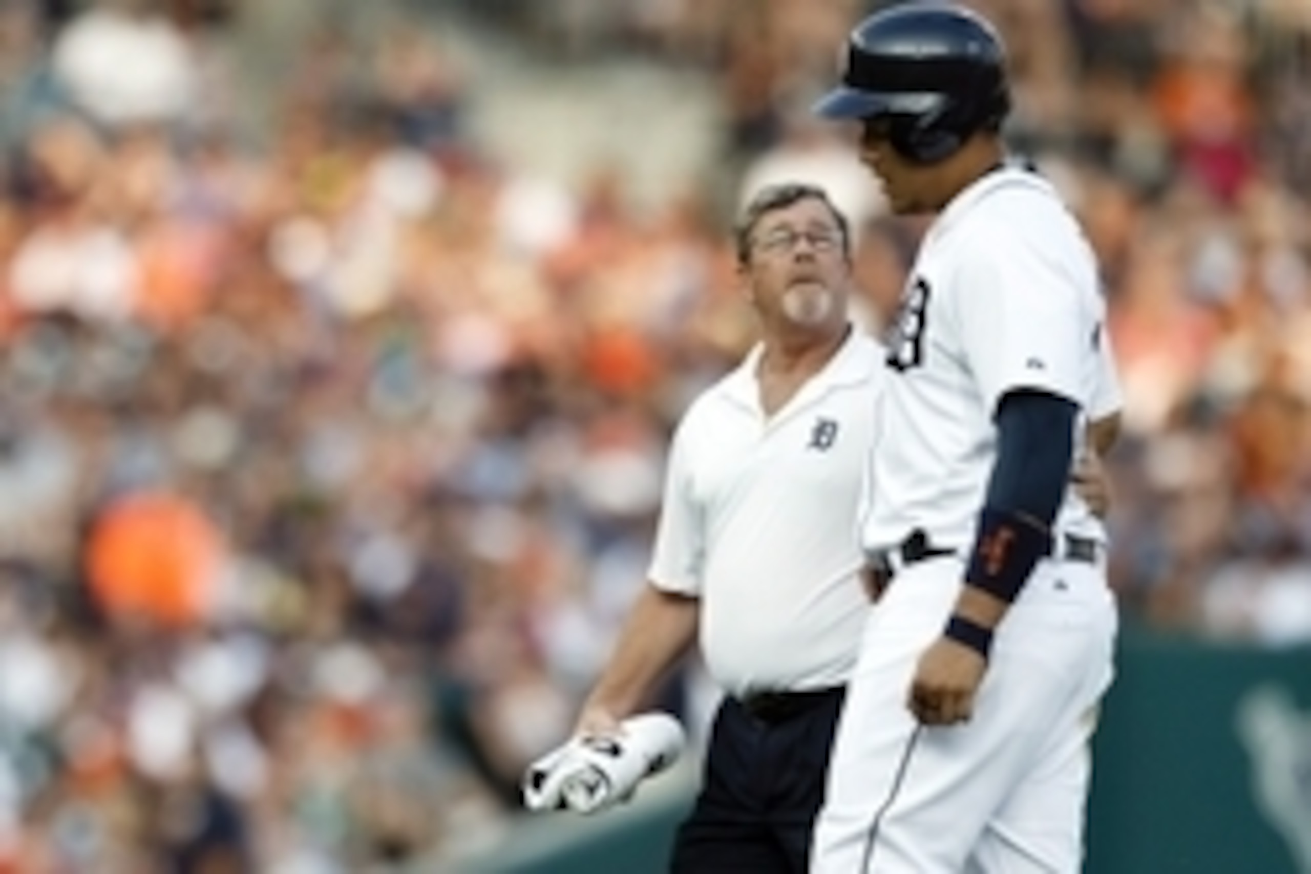 Jul 3, 2015; Detroit, MI, USA; Detroit Tigers first baseman Miguel Cabrera (24) is helped off the field by trainer Kevin Rand after getting injured in the fourth inning against the Toronto Blue Jays at Comerica Park. Mandatory Credit: Rick Osentoski-USA T