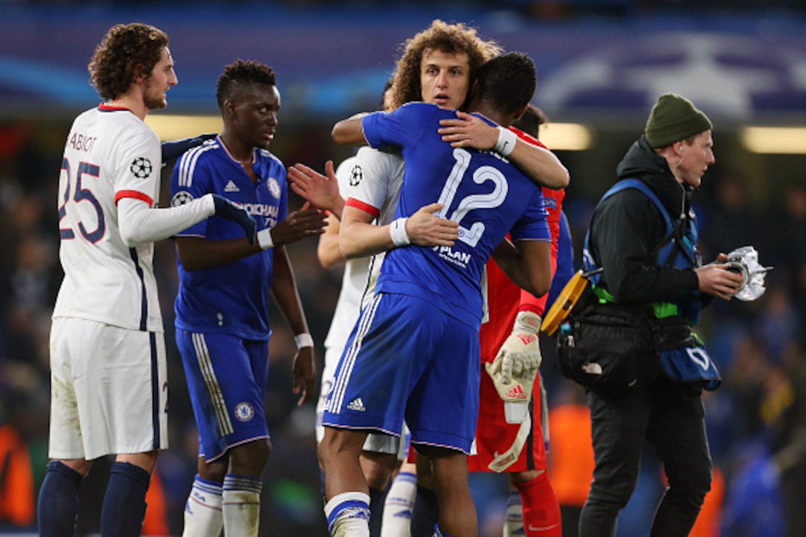 LONDON, ENGLAND - MARCH 09:  David Luiz of Paris Saint Germain hugs Mikel John Obi of Chelsea at the end of the UEFA Champions League match between Chelsea and Paris Saint-Germain at Stamford Bridge on March 9, 2016 in London, United Kingdom.  (Photo by C