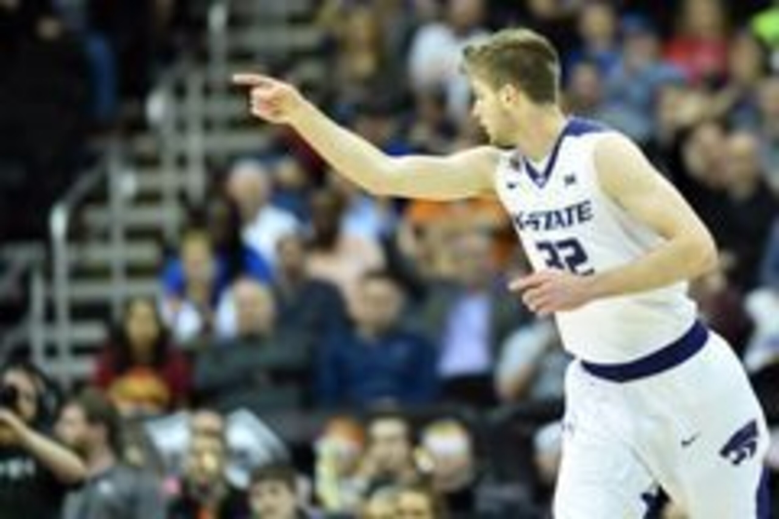 Mar 9, 2016; Kansas City, MO, USA; Kansas State Wildcats forward Dean Wade (32) celebrates after scoring in the first half against the Oklahoma State Cowboys during the Big 12 Conference tournament at Sprint Center. Mandatory Credit: Denny Medley-USA TODA