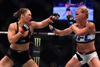 MELBOURNE, AUSTRALIA - NOVEMBER 15:  (L-R) Ronda Rousey faces Holly Holm in their UFC women's bantamweight championship bout during the UFC 193 event at Etihad Stadium on November 15, 2015 in Melbourne, Australia. (Photo by Jeff Bottari/Zuffa LLC/Zuffa LL