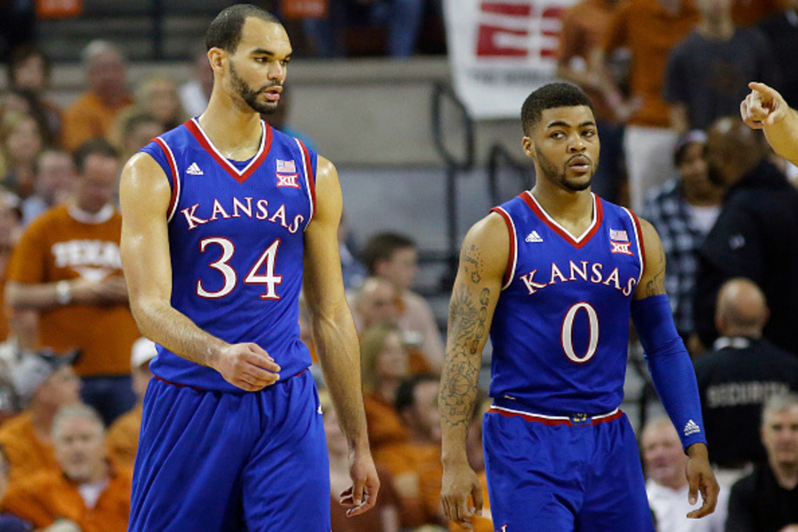 AUSTIN, TX - FEBRUARY 29: Perry Ellis #34 and Frank Mason III #0 of the Kansas Jayhawks walk on the court during the game with the Texas Longhorns at the Frank Erwin Center on February 29, 2016 in Austin, Texas. (Photo by Chris Covatta/Getty Images)