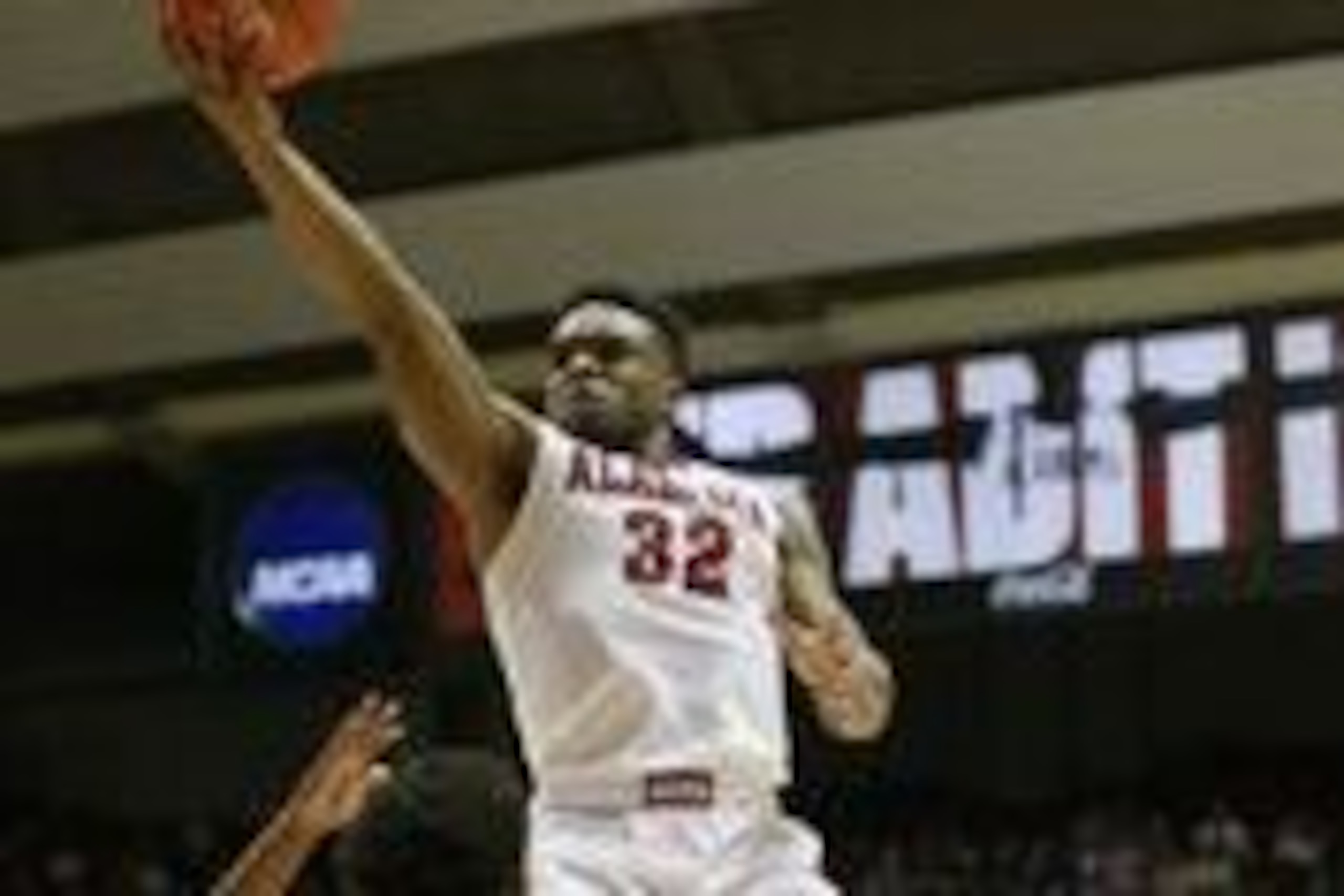 Mar 2, 2016; Tuscaloosa, AL, USA; Alabama Crimson Tide guard Retin Obasohan (32) goes to the basket against Arkansas Razorbacks guard Anton Beard (31) at Coleman Coliseum. The Razorbacks defeated the Crimson Tide 62-61. Mandatory Credit: Marvin Gentry-USA