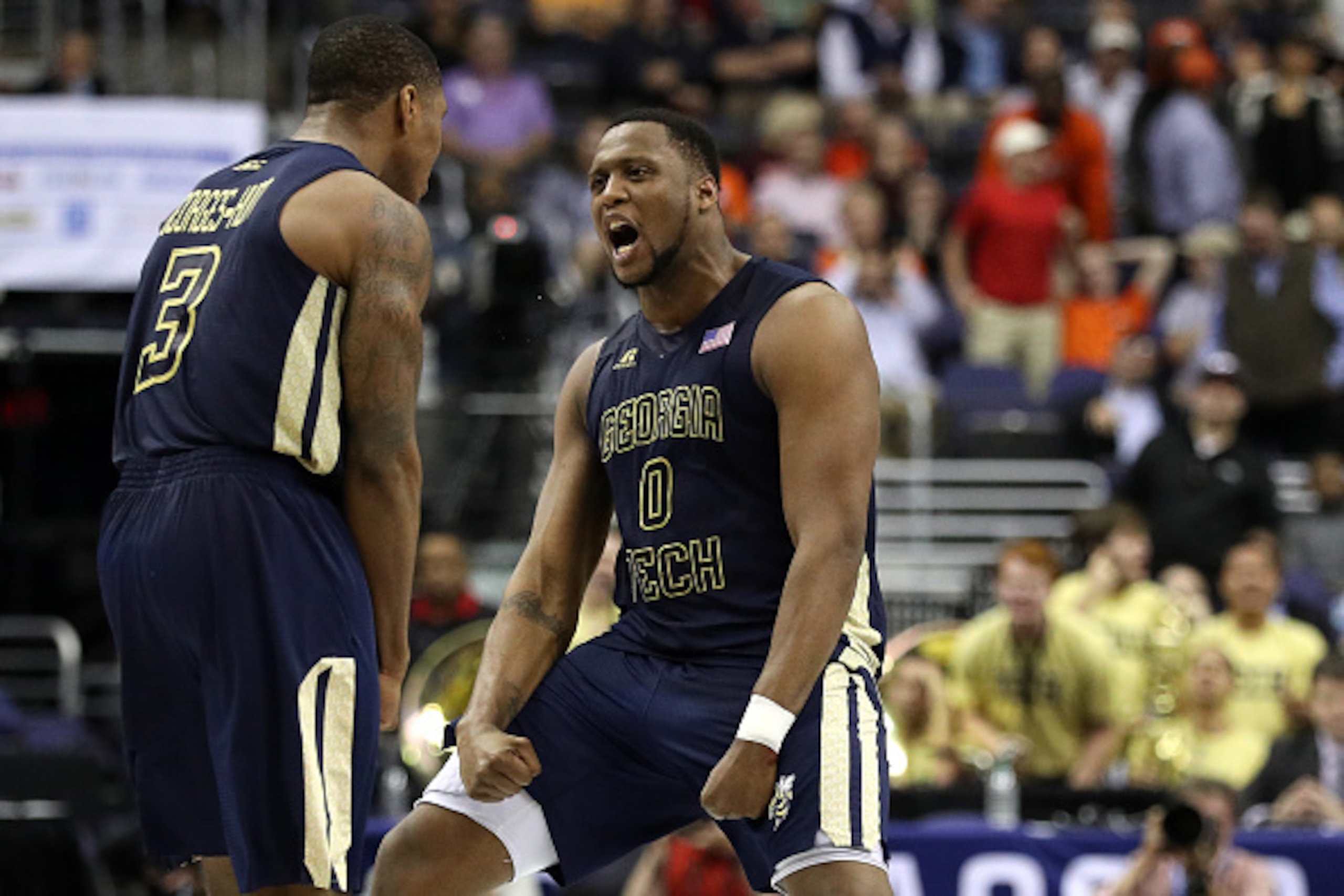 WASHINGTON, DC - MARCH 09: Charles Mitchell #0 and Marcus Georges-Hunt #3 of the Georgia Tech Yellow Jackets celebrate against the Clemson Tigers at the end of regulation in the second round of the 2016 ACC Basketball Tournament at Verizon Center on March