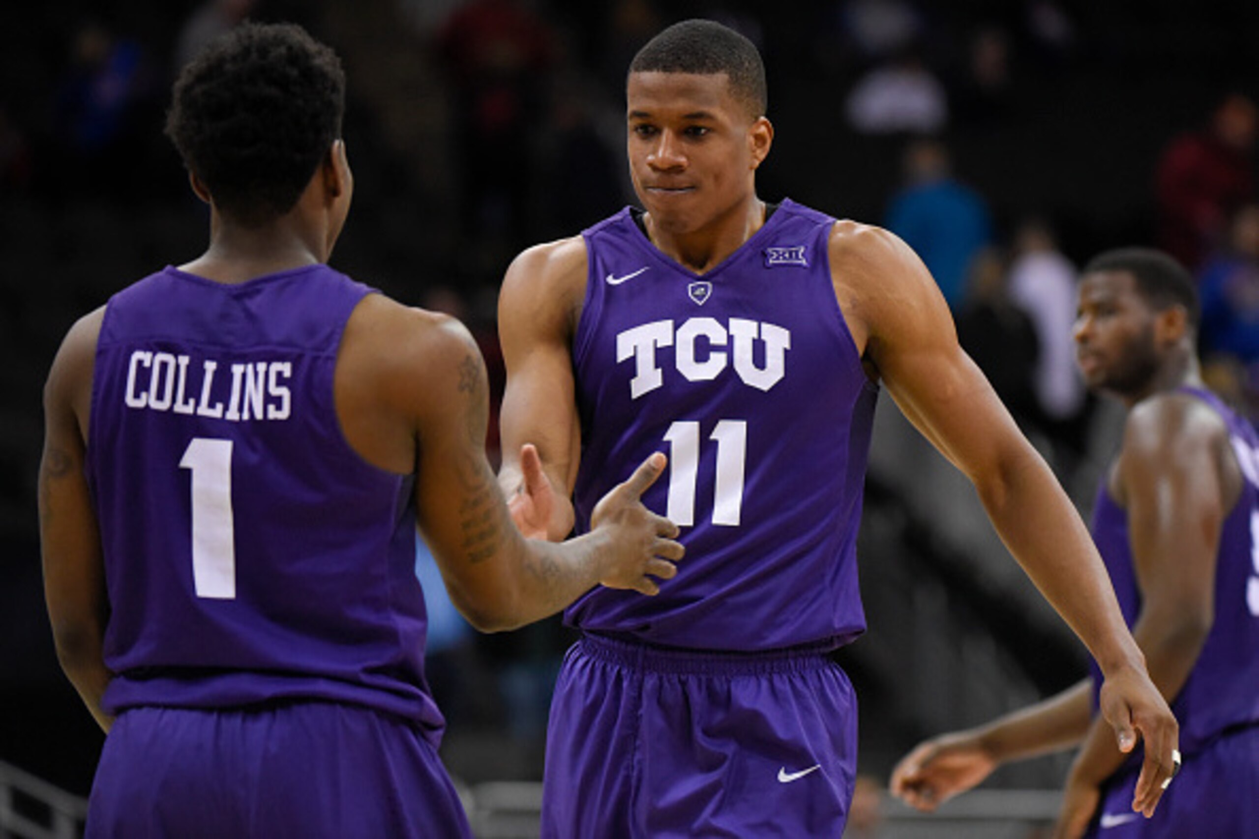 KANSAS CITY, MO - MARCH 9:  Chauncey Collins #1 and Brandon Parrish #11 of the TCU Horned Frogs celebrate a 67-62 win over the Texas Tech Red Raiders of the first round of the Big 12 Basketball Tournament at Sprint Center on March 9, 2016 Kansas City, Mis