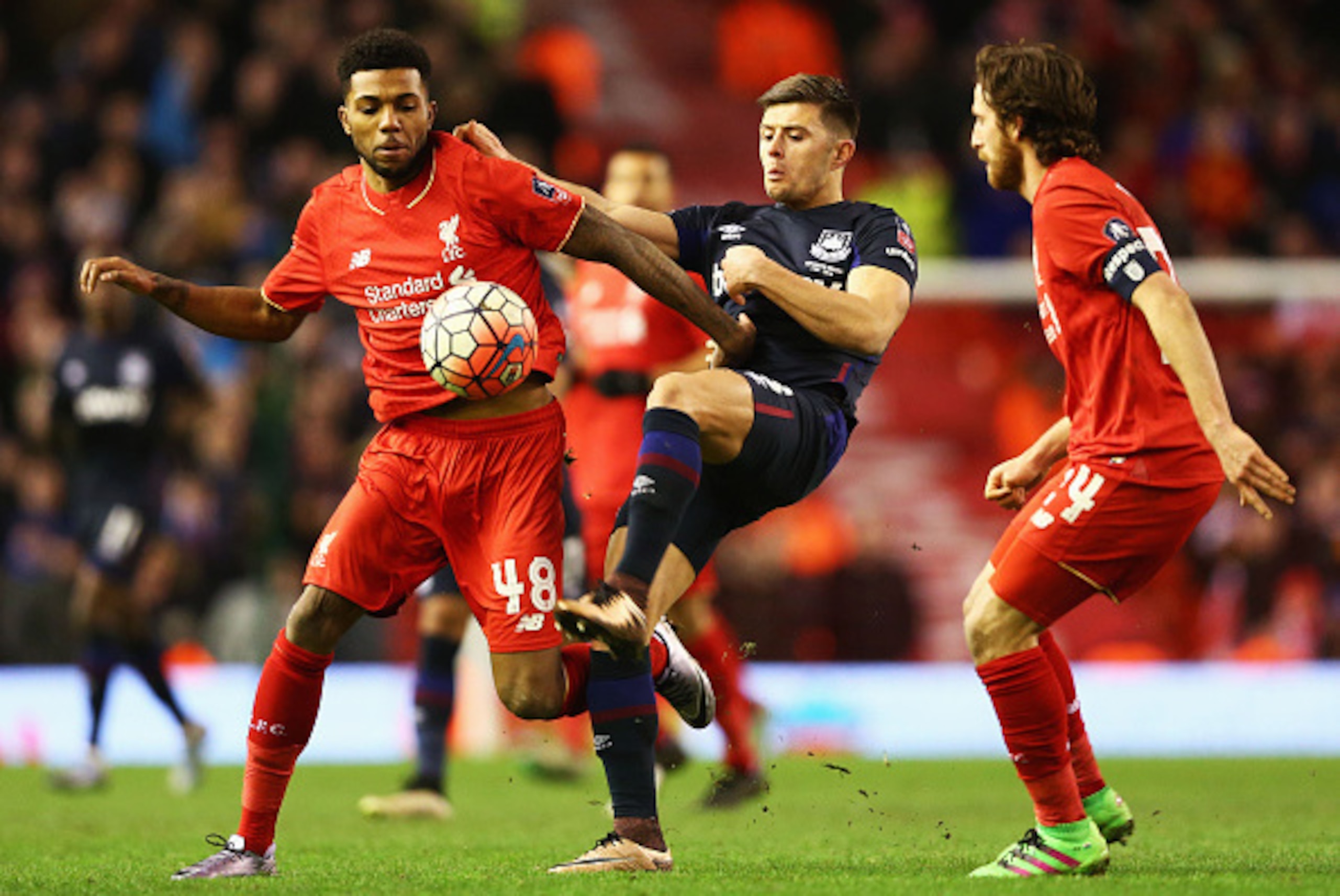 LIVERPOOL, ENGLAND - JANUARY 30: Aaron Cresswell of West Ham United battles with Jerome Sinclair (L) and Joe Allen of Liverpool during the Emirates FA Cup Fourth Round match between Liverpool and West Ham United at Anfield on January 30, 2016 in Liverpoo LIVERPOOL, ENGLAND - JANUARY 30: Aaron Cresswell of West Ham United battles with Jerome Sinclair (L) and Joe Allen of Liverpool during the Emirates FA Cup Fourth Round match between Liverpool and West Ham United at Anfield on January 30, 2016 in Liverpoo