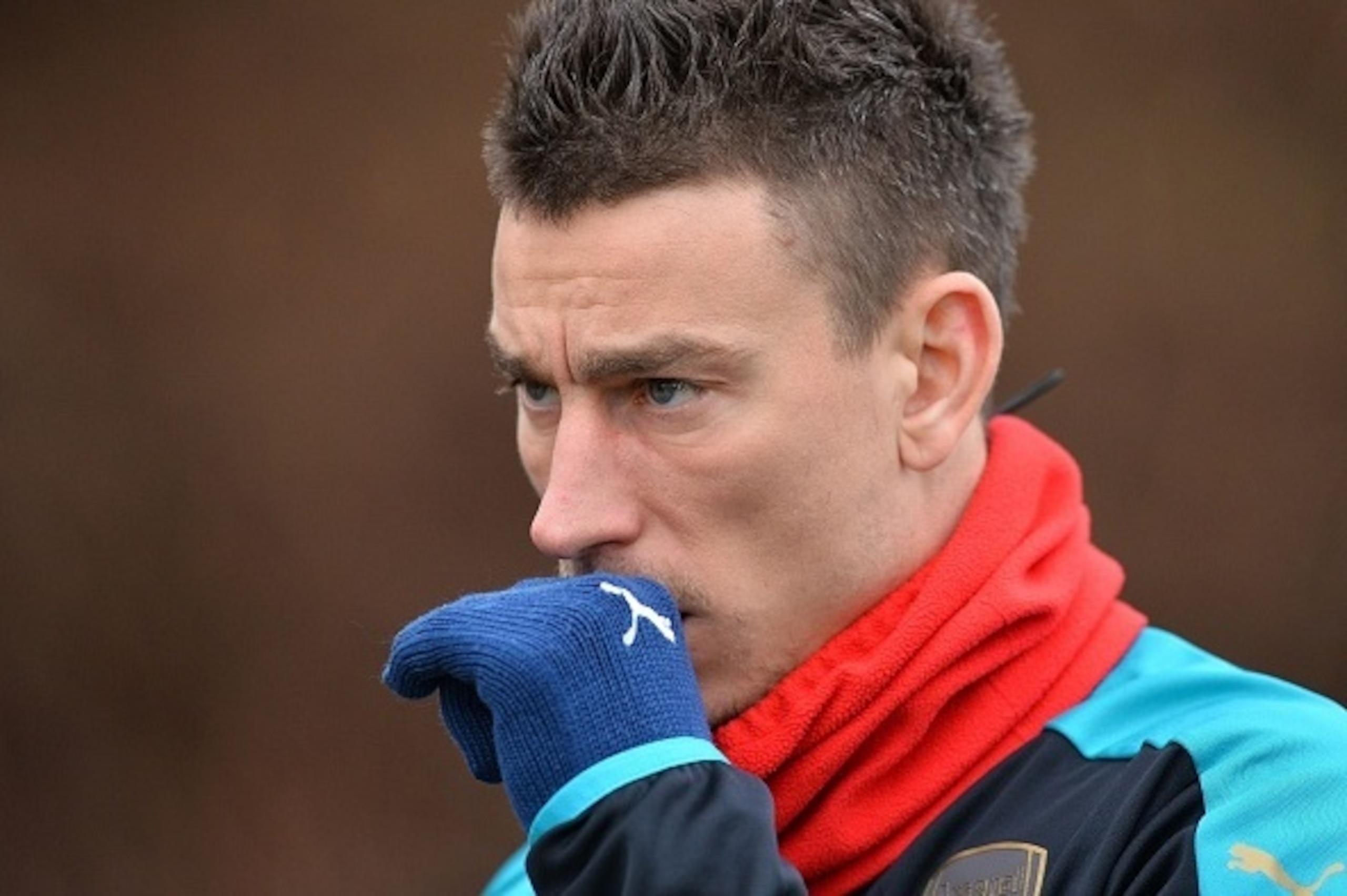 Arsenal's French defender Laurent Koscielny is pictured as he takes part in a training session ahead of the UEFA Champions League round of 16 1st leg football match against Barcelona at Arsenal's London Colney training ground on February 22, 2016. 

Arsen