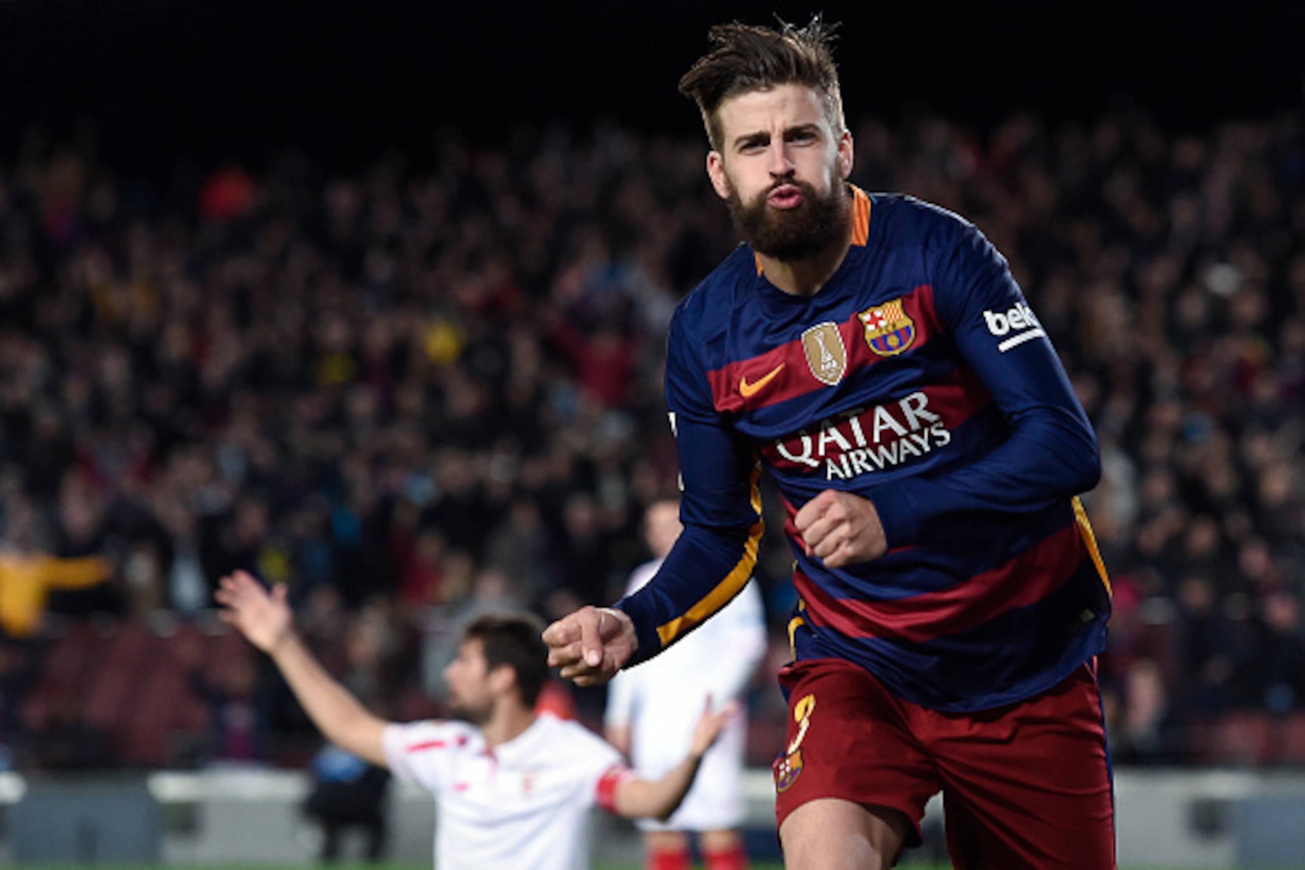 Barcelona's defender Gerard Pique celebrates a goal during the Spanish league football match FC Barcelona vs Sevilla FC at the Camp Nou stadium in Barcelona on February 28, 2016. / AFP / JOSEP LAGO        (Photo credit should read JOSEP LAGO/AFP/Getty Ima