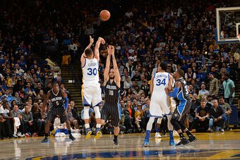 OAKLAND, CA - MARCH 7:   Stephen Curry #30 of the Golden State Warriors shoots a three point basket against the Orlando Magic on March 7, 2016 at ORACLE Arena in Oakland, California. NOTE TO USER: User expressly acknowledges and agrees that, by downloadin