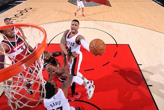 PORTLAND, OR - MARCH 8: Damian Lillard #0 of the Portland Trail Blazers goes for the lay up during the game against the Washington Wizards on March 8, 2016 at the Moda Center Arena in Portland, Oregon. NOTE TO USER: User expressly acknowledges and agrees 