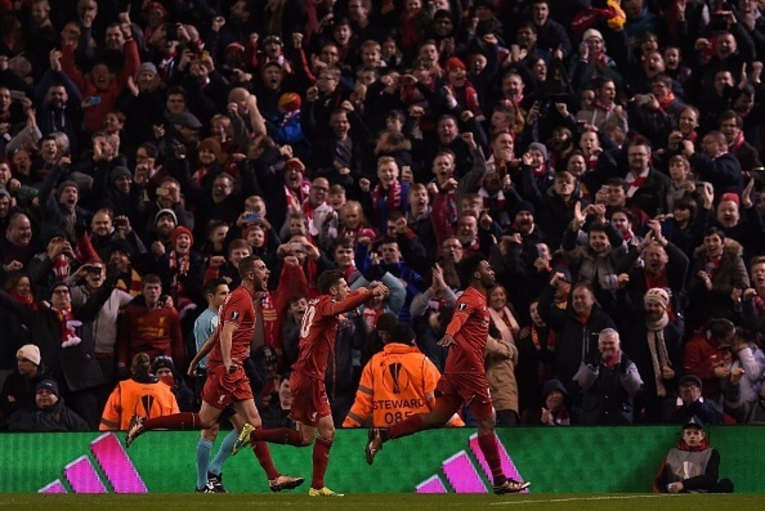 Liverpool's English striker Daniel Sturridge (R) celebrates scoring his team's first goal from the peanlty spot during the UEFA Europa League round of 16, first leg football match between Liverpool and Manchester United at Anfield in Liverpool, northwest Liverpool's English striker Daniel Sturridge (R) celebrates scoring his team's first goal from the peanlty spot during the UEFA Europa League round of 16, first leg football match between Liverpool and Manchester United at Anfield in Liverpool, northwest