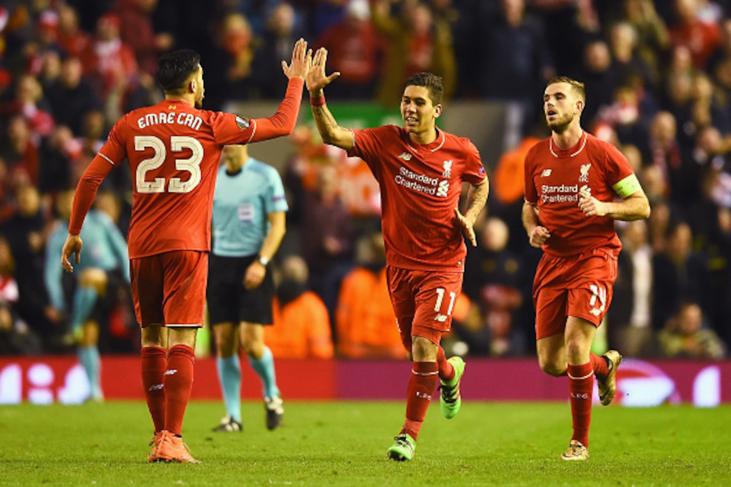 LIVERPOOL, ENGLAND - MARCH 10: Roberto Firmino of Liverpool (11) celebrates with Emre Can (23) as he scores their second goal during the UEFA Europa League Round of 16 first leg match between Liverpool and Manchester United at Anfield on March 10, 2016 i LIVERPOOL, ENGLAND - MARCH 10: Roberto Firmino of Liverpool (11) celebrates with Emre Can (23) as he scores their second goal during the UEFA Europa League Round of 16 first leg match between Liverpool and Manchester United at Anfield on March 10, 2016 i