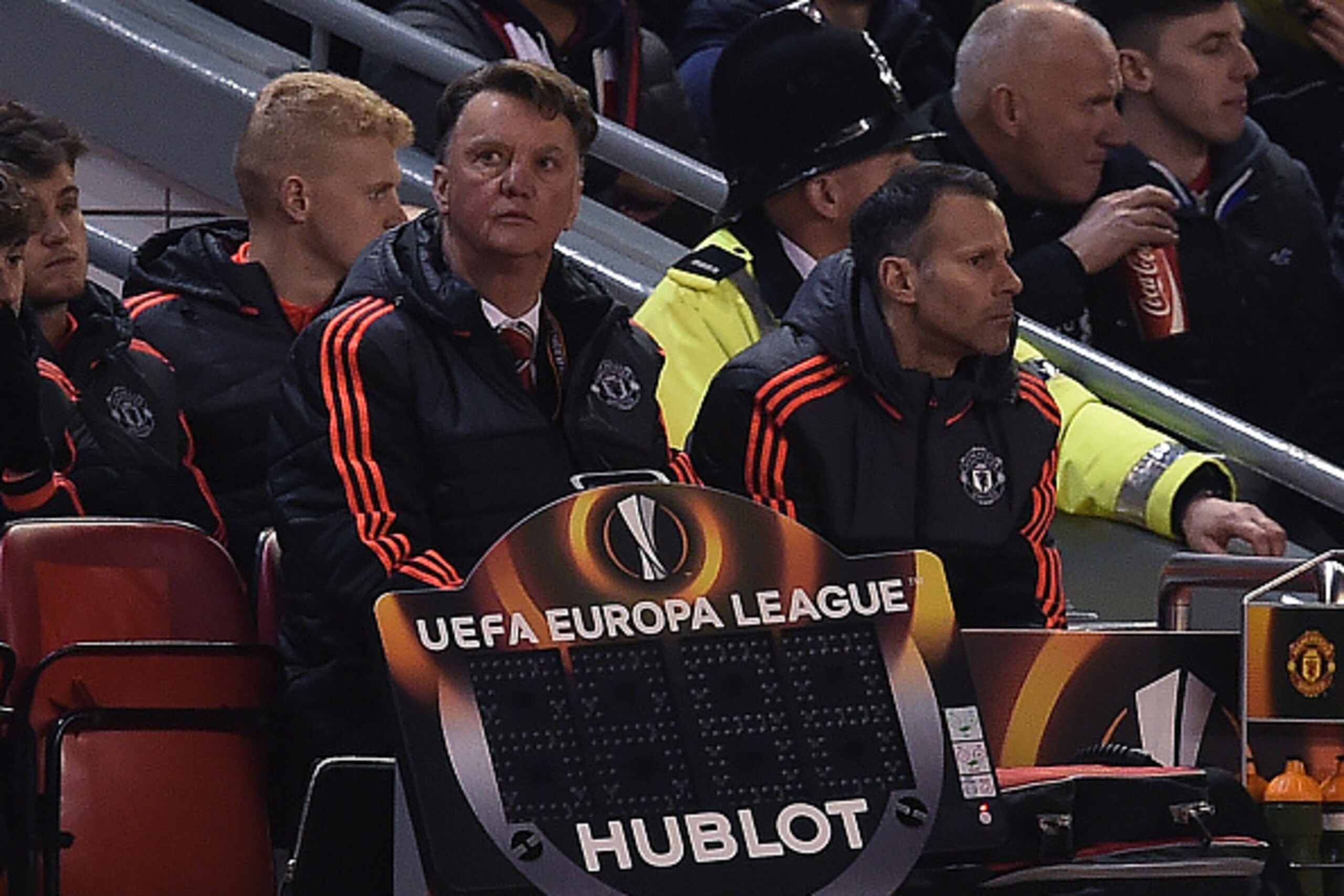 Manchester United's Dutch manager Louis van Gaal (L) and Manchester United's Welsh assistant manager Ryan Giggs sits in the dug out during the UEFA Europa League round of 16, first leg football match between Liverpool and Manchester United at Anfield in L Manchester United's Dutch manager Louis van Gaal (L) and Manchester United's Welsh assistant manager Ryan Giggs sits in the dug out during the UEFA Europa League round of 16, first leg football match between Liverpool and Manchester United at Anfield in L