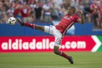 Mar 6, 2016; Dallas, TX, USA;  FC Dallas forward Tesho Akindele (13) kicks the ball towards the goal in the second half against the Philadelphia Union at Toyota Stadium. FC Dallas won 2-0. Mandatory Credit: Tim Heitman-USA TODAY Sports