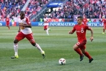 Mar 6, 2016; Harrison, NJ, USA; Toronto FC forward Sebastian Giovinco (10) advances the ball past New York Red Bulls d Ronald Zubar (23) during the second half at Red Bull Arena. Toronto FC won, 2-0. Mandatory Credit: Vincent Carchietta-USA TODAY Sports