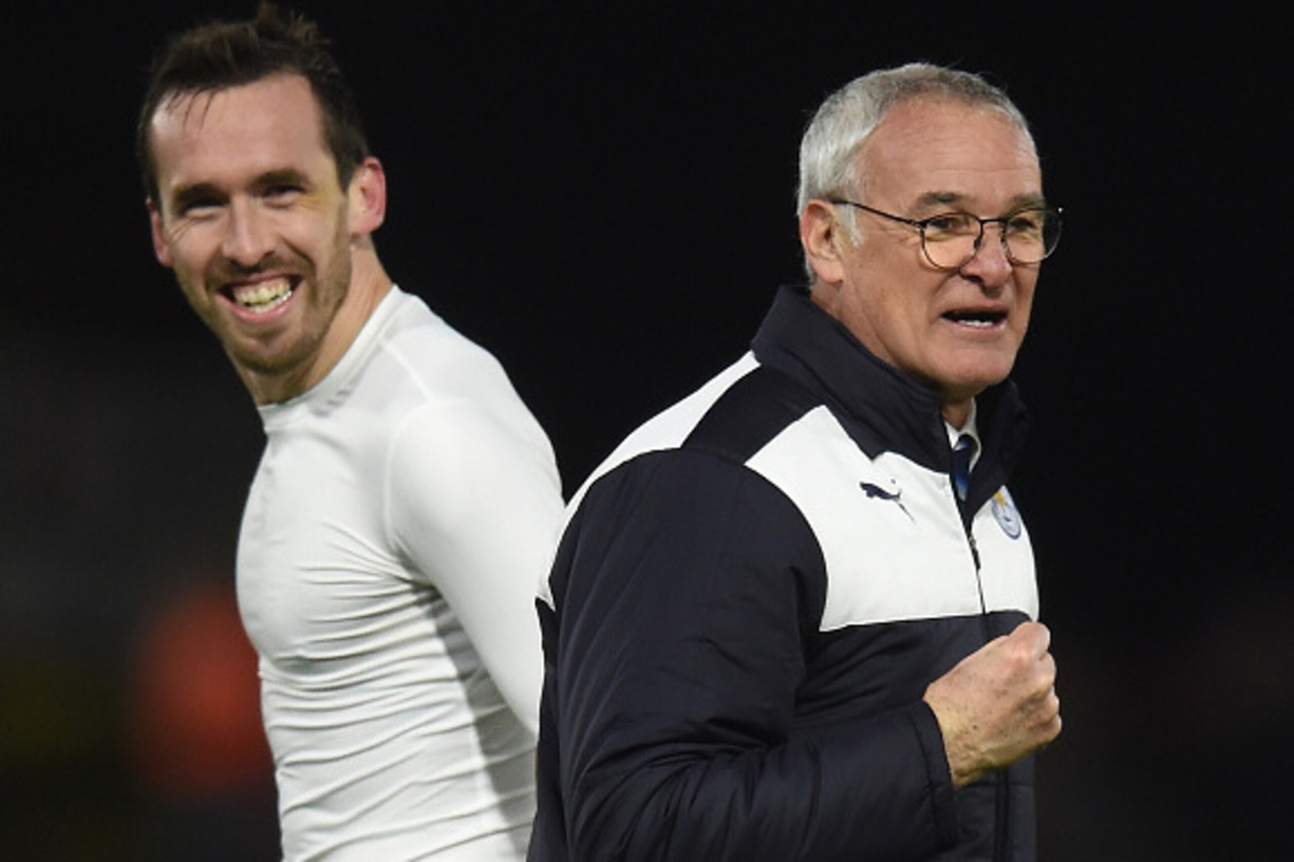 WATFORD, ENGLAND - MARCH 05: Claudio Ranieri (R) Manager of Leicester City and Christian Fuchs (L) celebrate their 1-0 win in the Barclays Premier League match between Watford and Leicester City at Vicarage Road on March 5, 2016 in Watford, England.  (Pho