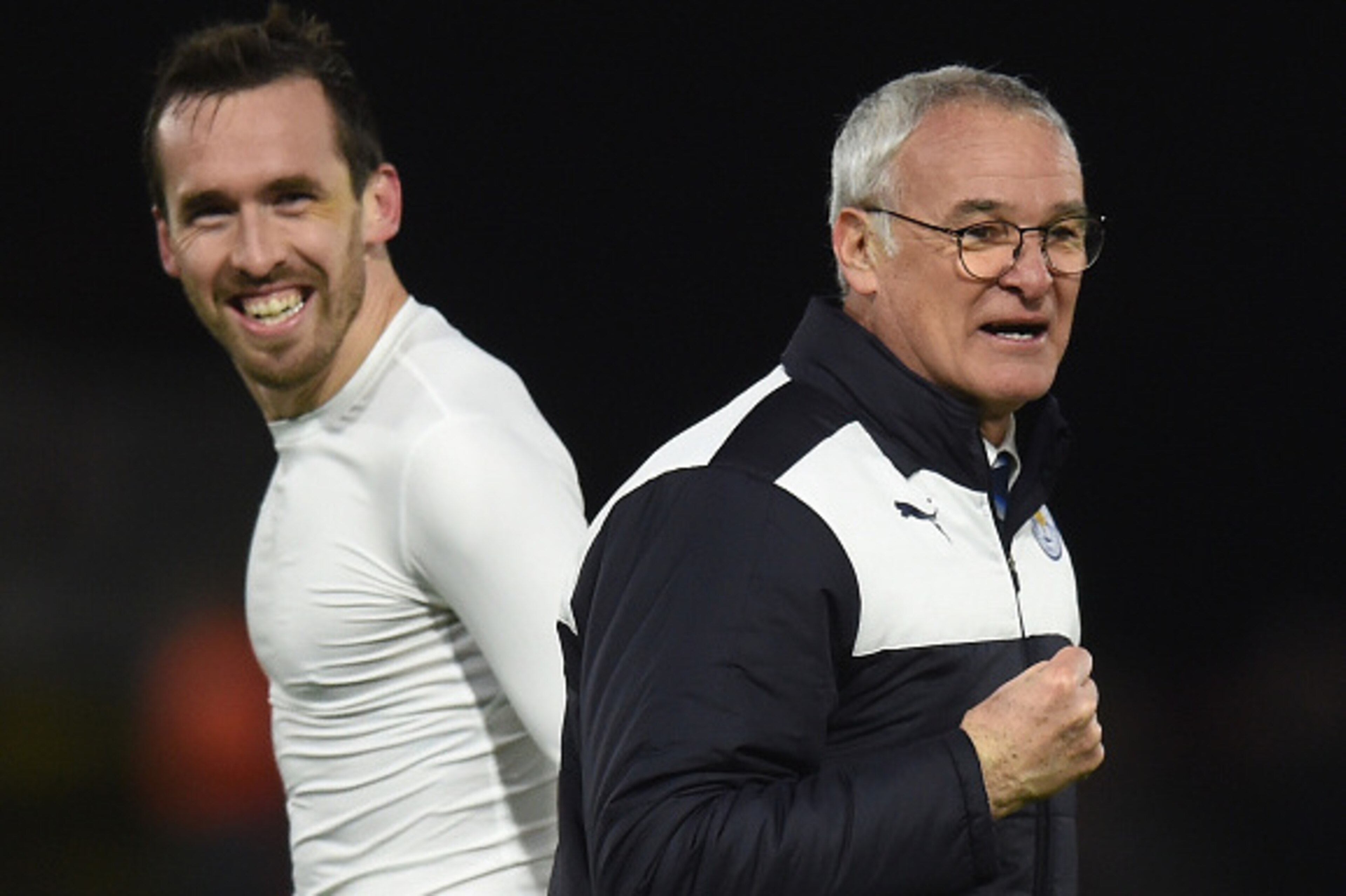 WATFORD, ENGLAND - MARCH 05: Claudio Ranieri (R) Manager of Leicester City and Christian Fuchs (L) celebrate their 1-0 win in the Barclays Premier League match between Watford and Leicester City at Vicarage Road on March 5, 2016 in Watford, England.  (Pho