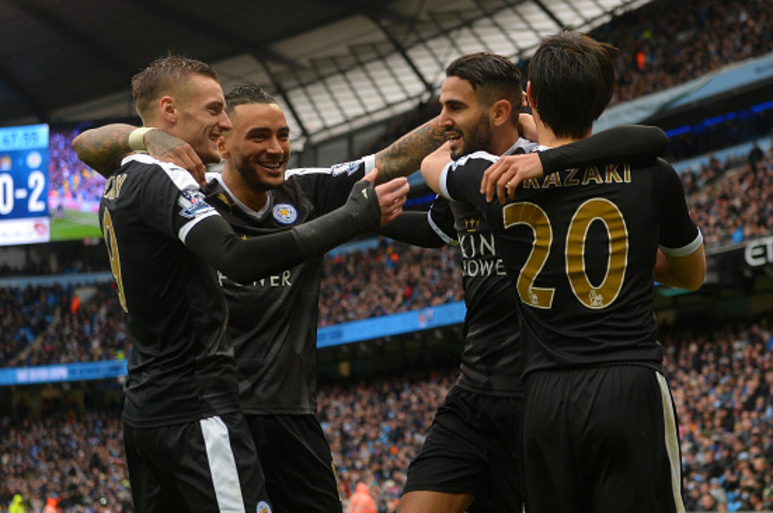 MANCHESTER, ENGLAND - FEBRUARY 06:  Riyad Mahrez (2nd R) of Leicester City celebrates scoring his team's second goal with his team mates Shinji Okazaki (1st R), Danny Simpson  (2nd L) and Jamie Vardy (1st L) during the Barclays Premier League match betwee