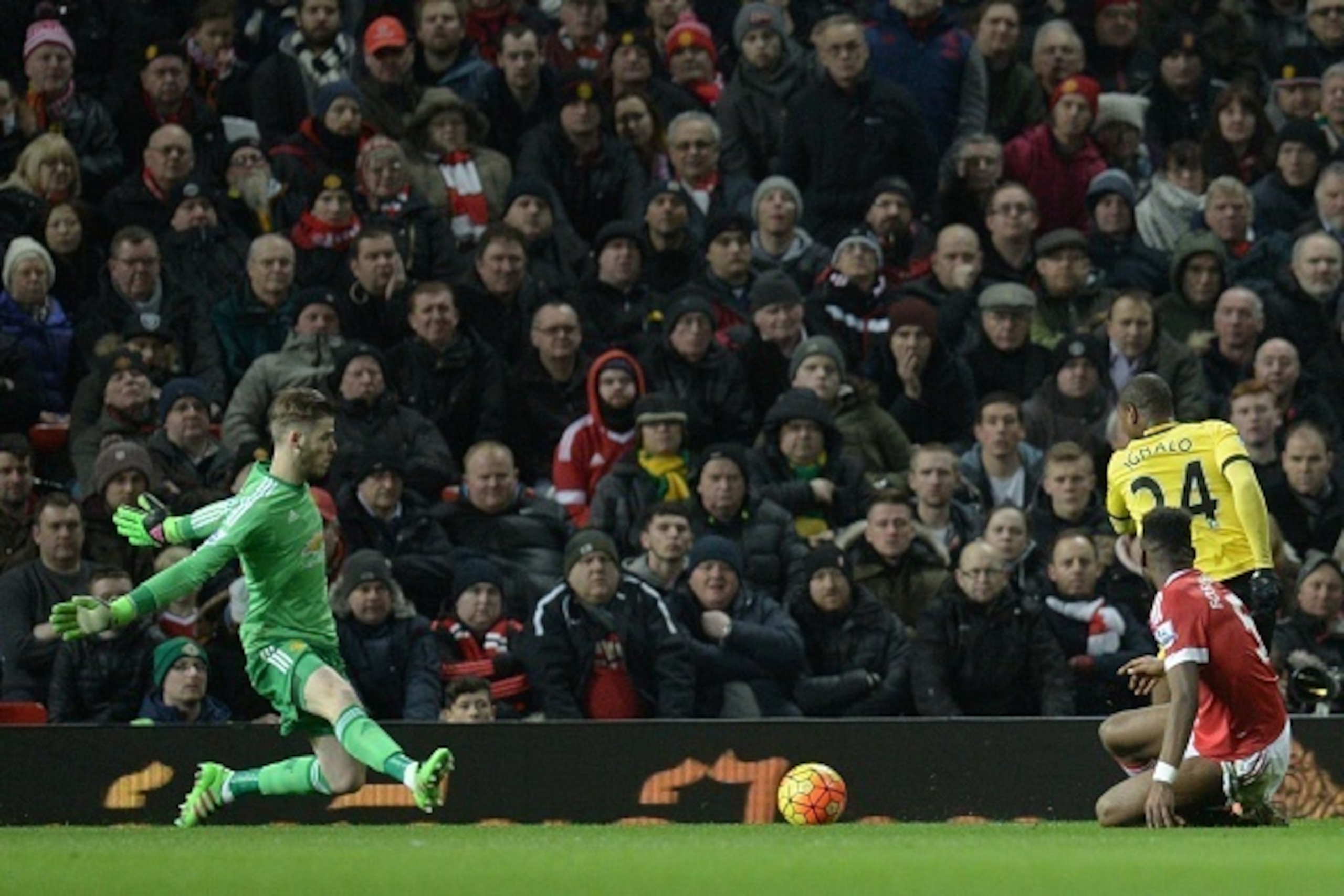 Manchester United's Spanish goalkeeper David de Gea (L) saves from Watford's Nigerian striker Odion Ighalo (R) during the English Premier League football match between Manchester United and Watford at Old Trafford in Manchester in north west England on Ma Manchester United's Spanish goalkeeper David de Gea (L) saves from Watford's Nigerian striker Odion Ighalo (R) during the English Premier League football match between Manchester United and Watford at Old Trafford in Manchester in north west England on Ma
