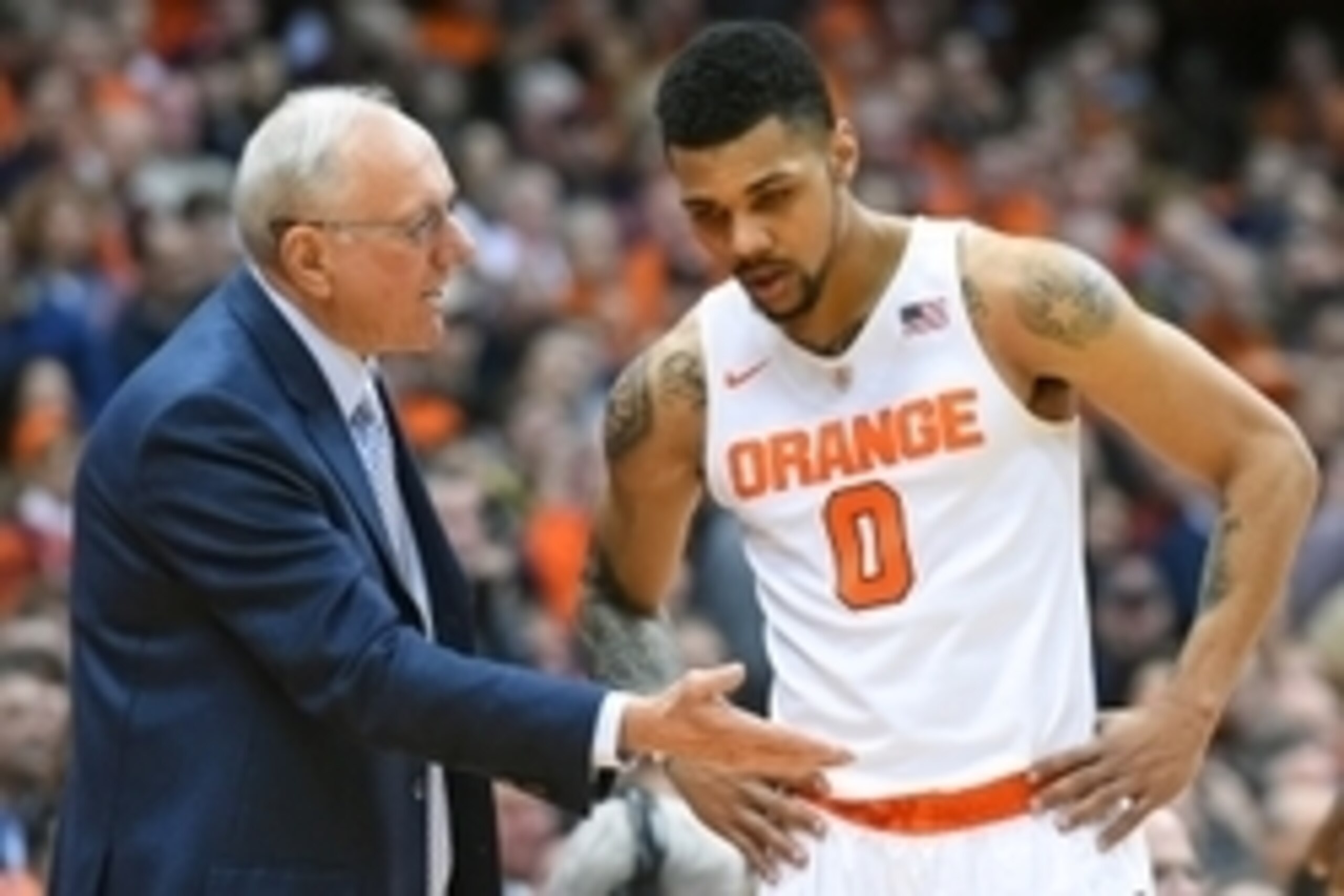 Jan 28, 2016; Syracuse, NY, USA; Syracuse Orange head coach Jim Boeheim talks with forward Michael Gbinije (0) against the Notre Dame Fighting Irish during the second half at the Carrier Dome.  Syracuse defeated Notre Dame 81-66.  Mandatory Credit: Rich B