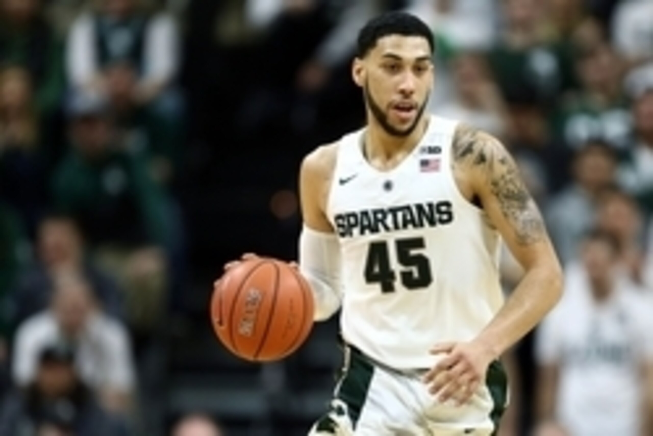 Mar 5, 2016; East Lansing, MI, USA; Michigan State Spartans guard Denzel Valentine (45) brings the ball up court during the first half of a game against the Ohio State Buckeyes at Jack Breslin Student Events Center. Mandatory Credit: Mike Carter-USA TODAY