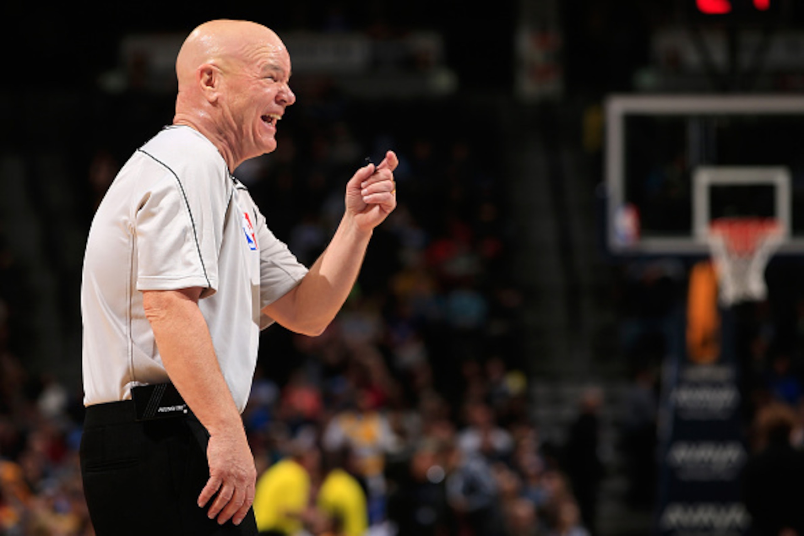 DENVER, CO - NOVEMBER 03: Referee Joey Crawford shares a lighter moment as he oversees the action between the Sacramento Kings and the Denver Nuggets at Pepsi Center on November 3, 2014 in Denver, Colorado. The Kings defeated the Nuggets 110-105. NOTE TO DENVER, CO - NOVEMBER 03: Referee Joey Crawford shares a lighter moment as he oversees the action between the Sacramento Kings and the Denver Nuggets at Pepsi Center on November 3, 2014 in Denver, Colorado. The Kings defeated the Nuggets 110-105. NOTE TO