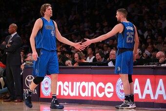 LOS ANGELES, CA - JANUARY 26: Dirk Nowitzki #41 of the Dallas Mavericks gets a hand slap from teammate Chandler Parsons #25 during the NBA game against the Los Angeles Lakers at Staples Center on January 26, 2016 in Los Angeles, California. The Mavericks 