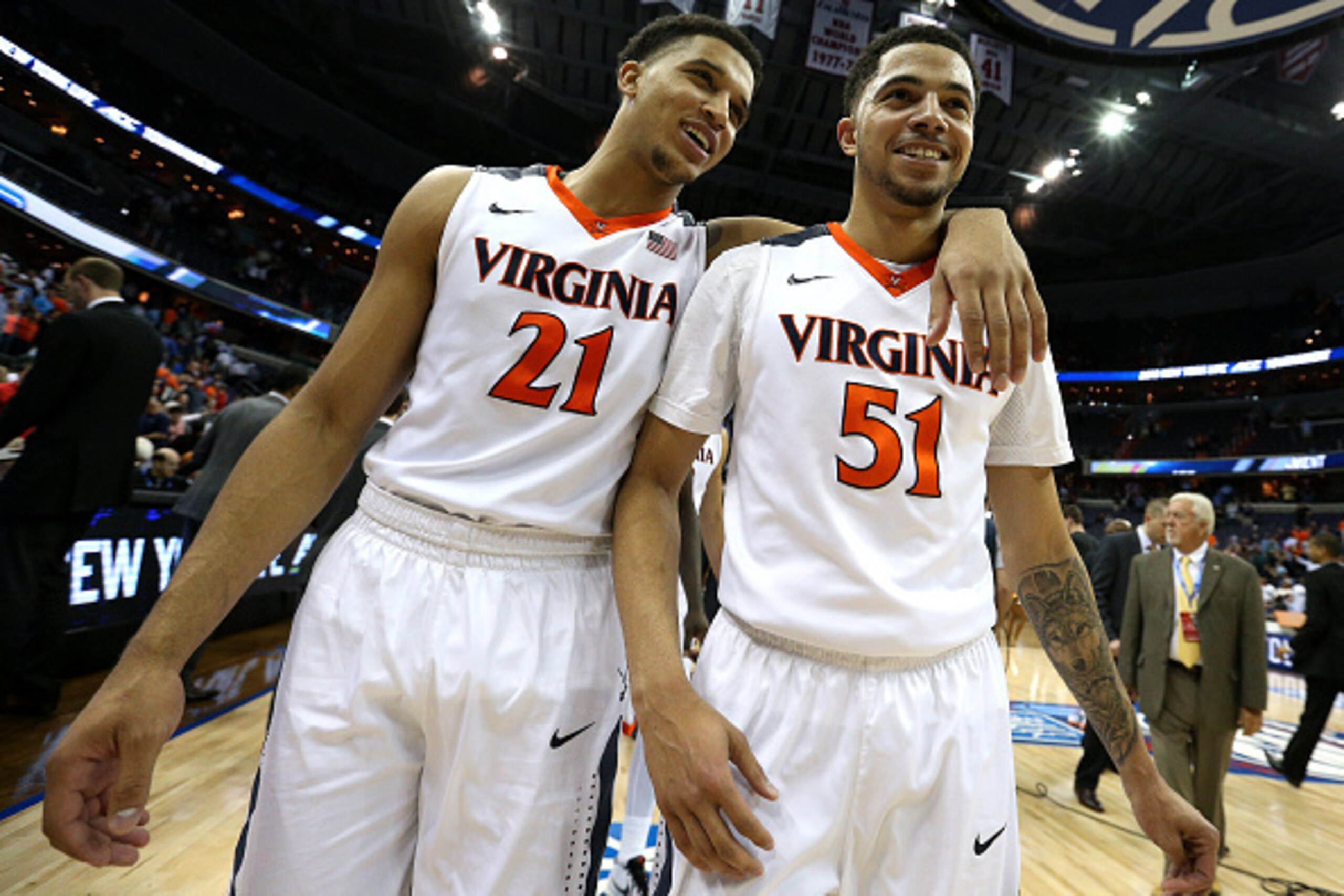 WASHINGTON, DC - MARCH 11: Isaiah Wilkins #21 and Darius Thompson #51 of the Virginia Cavaliers celebrate after defeating the Miami (Fl) Hurricanes in the semifinals of the 2016 ACC Basketball Tournament at Verizon Center on March 11, 2016 in Washington, 