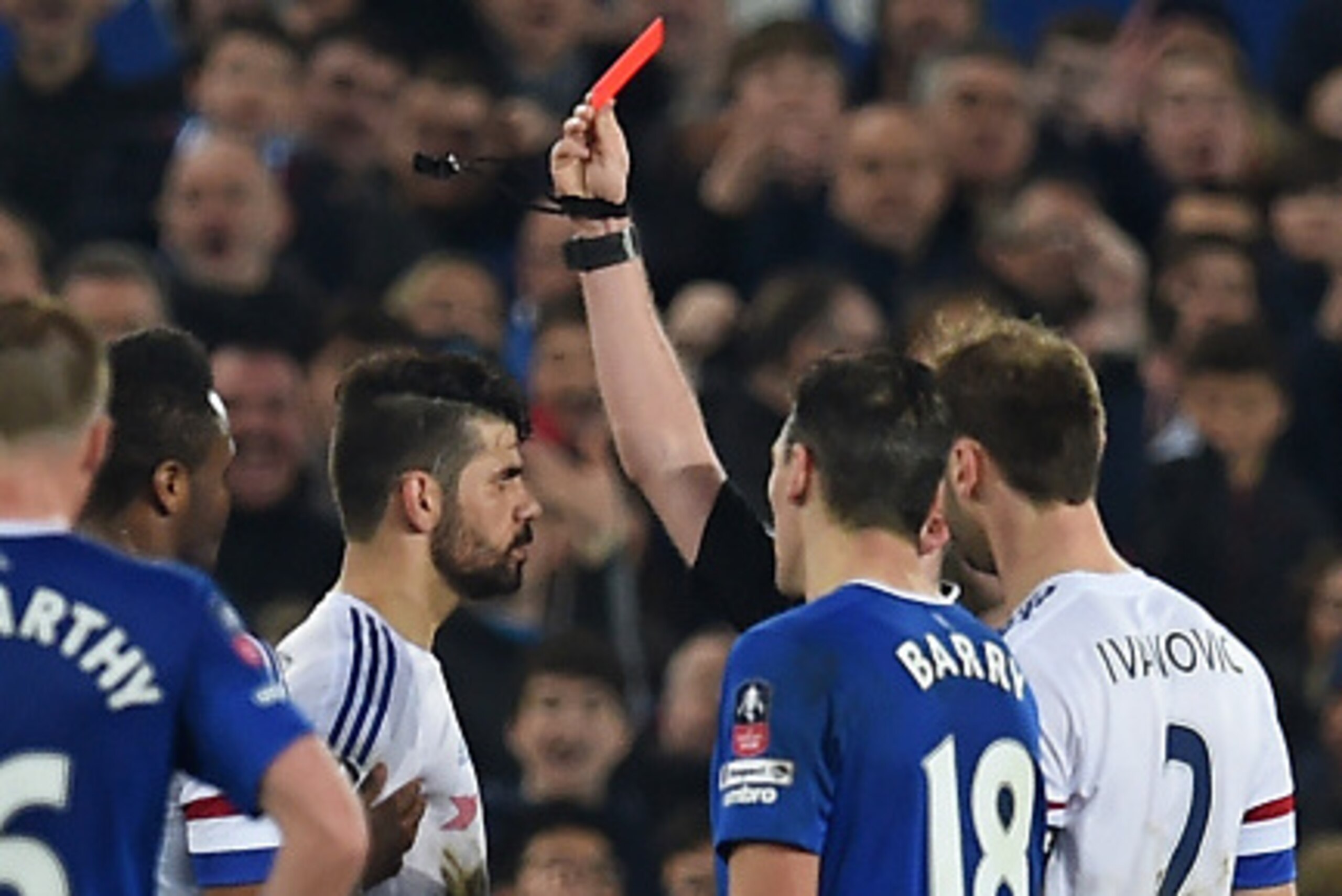 Chelsea's Brazilian-born Spanish striker Diego Costa (3rd L) is shown a red card by referee Michael Oliver during the English FA cup quarter-final football match between Everton and Chelsea at Goodison Park in Liverpool, north west England on March 12, 20