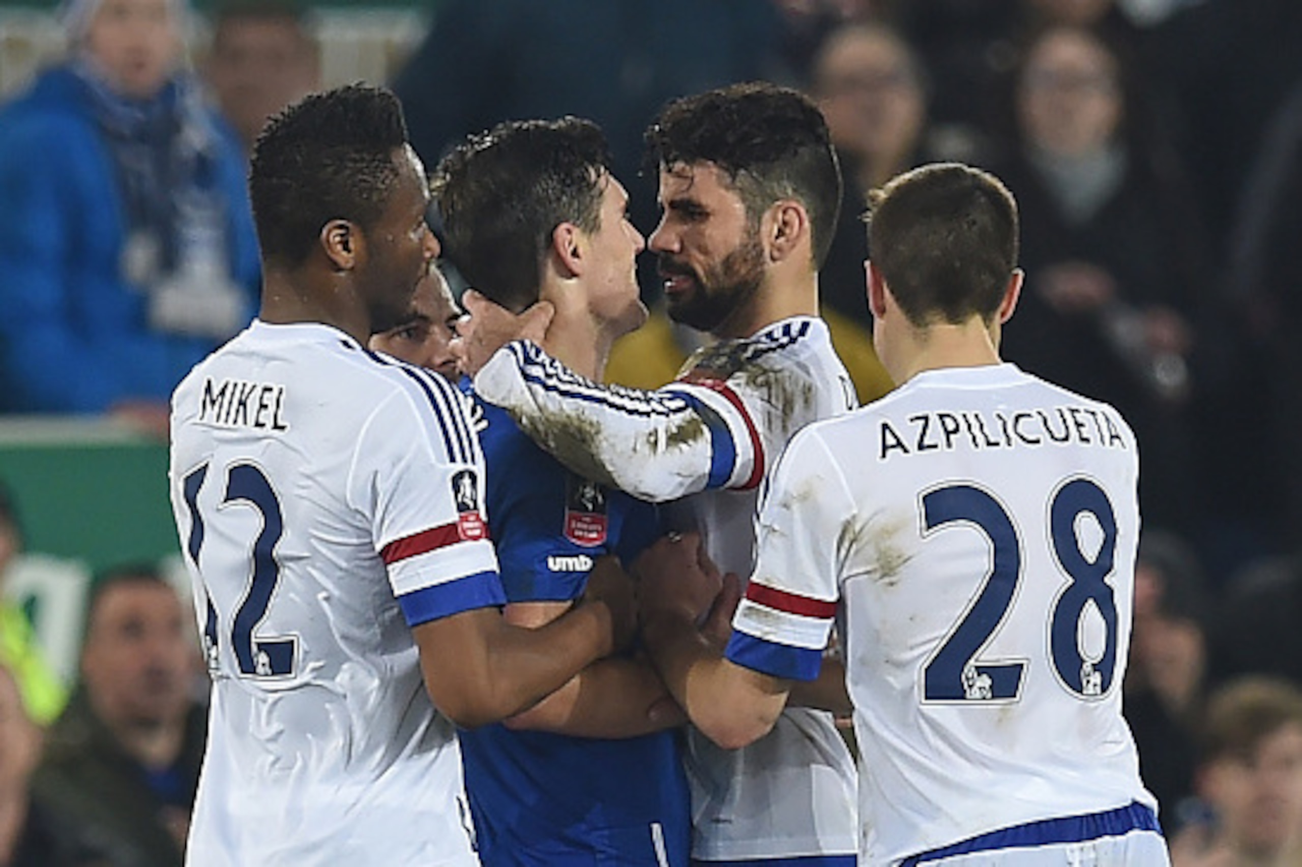 Chelsea's Brazilian-born Spanish striker Diego Costa (2nd R) and Everton's English midfielder Gareth Barry clash in the incident leading to Costa's second yellow card during the English FA cup quarter-final football match between Everton and Chelsea at Go