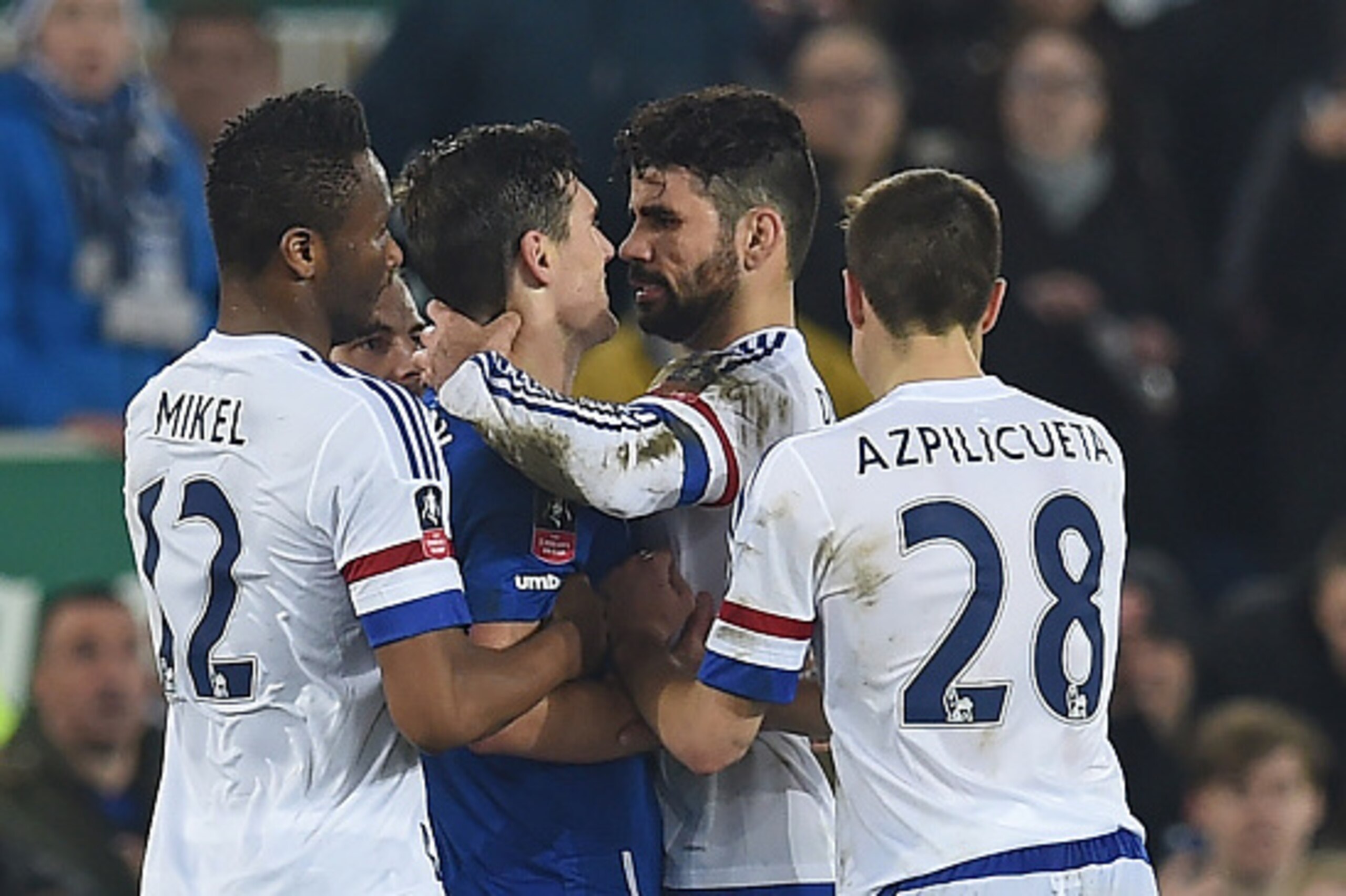 Chelsea's Brazilian-born Spanish striker Diego Costa (2nd R) and Everton's English midfielder Gareth Barry clash in the incident leading to Costa's second yellow card during the English FA cup quarter-final football match between Everton and Chelsea at Go