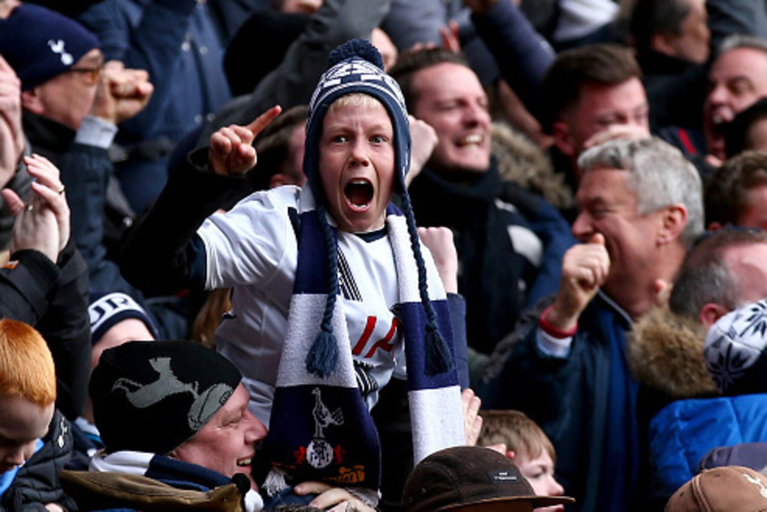 LONDON, ENGLAND - MARCH 05:  A young Tottenham Hotspur supporter reacts after Harry Kane of Tottenham Hotspur scores his team's second goal during the Barclays Premier League match between Tottenham Hotspur and Arsenal at White Hart Lane on March 5, 2016 