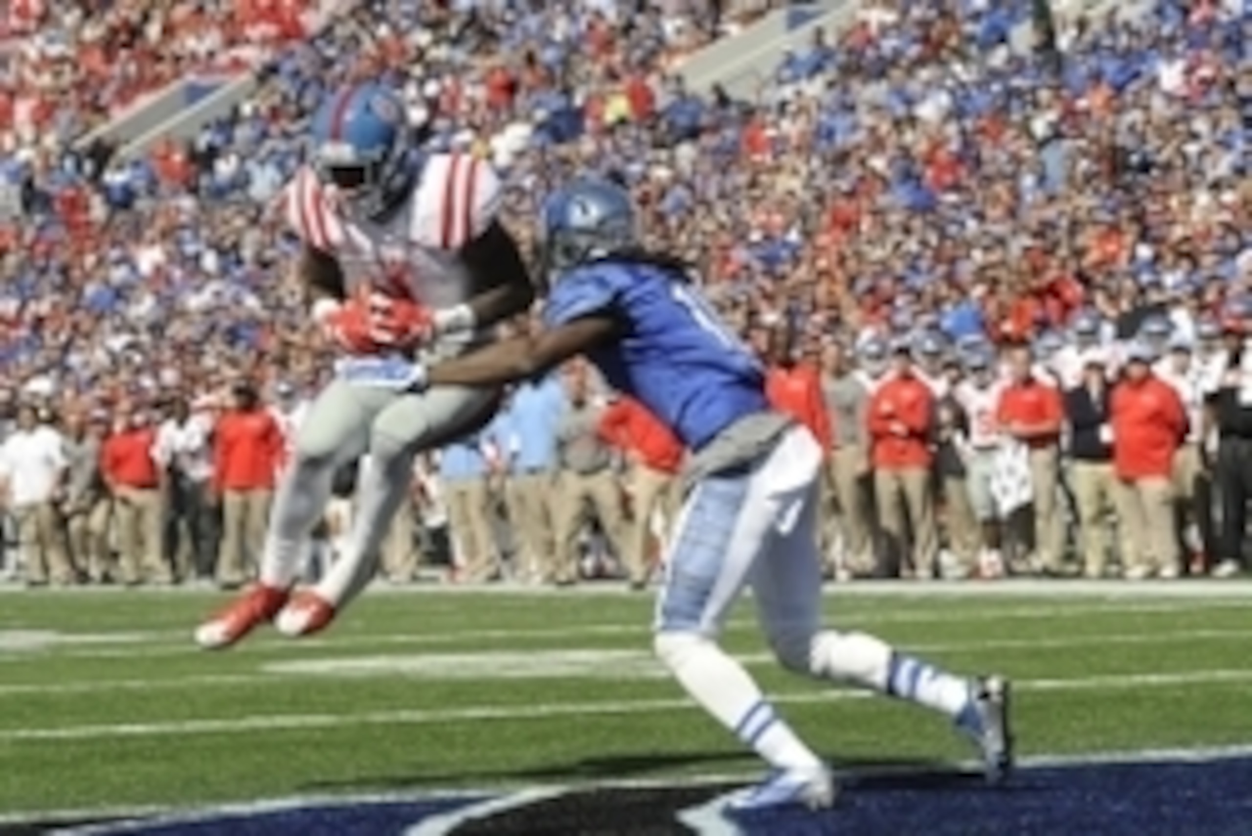 Oct 17, 2015; Memphis, TN, USA; Mississippi Rebels wide receiver Laquon Treadwell (1) catches a touchdown pass against Memphis Tigers defensive back Dontrell Nelson (10) during the game at Liberty Bowl Memorial Stadium. Memphis Tigers beat Mississippi Reb