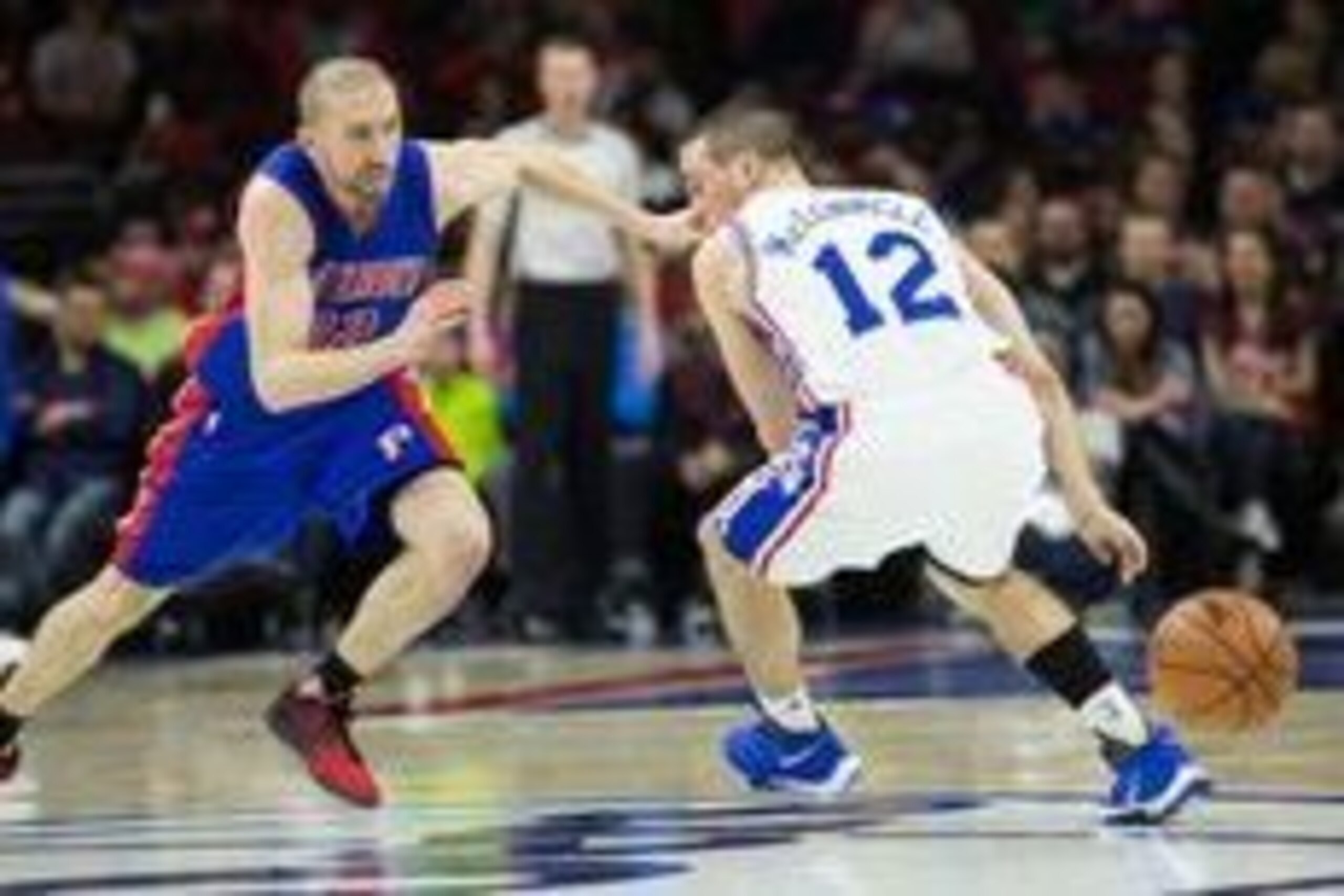 Mar 12, 2016; Philadelphia, PA, USA; Detroit Pistons guard Steve Blake (22) steals the ball from Philadelphia 76ers guard T.J. McConnell (12) during the second half at Wells Fargo Center. The Detroit Pistons won 125-111. Mandatory Credit: Bill Streicher-U