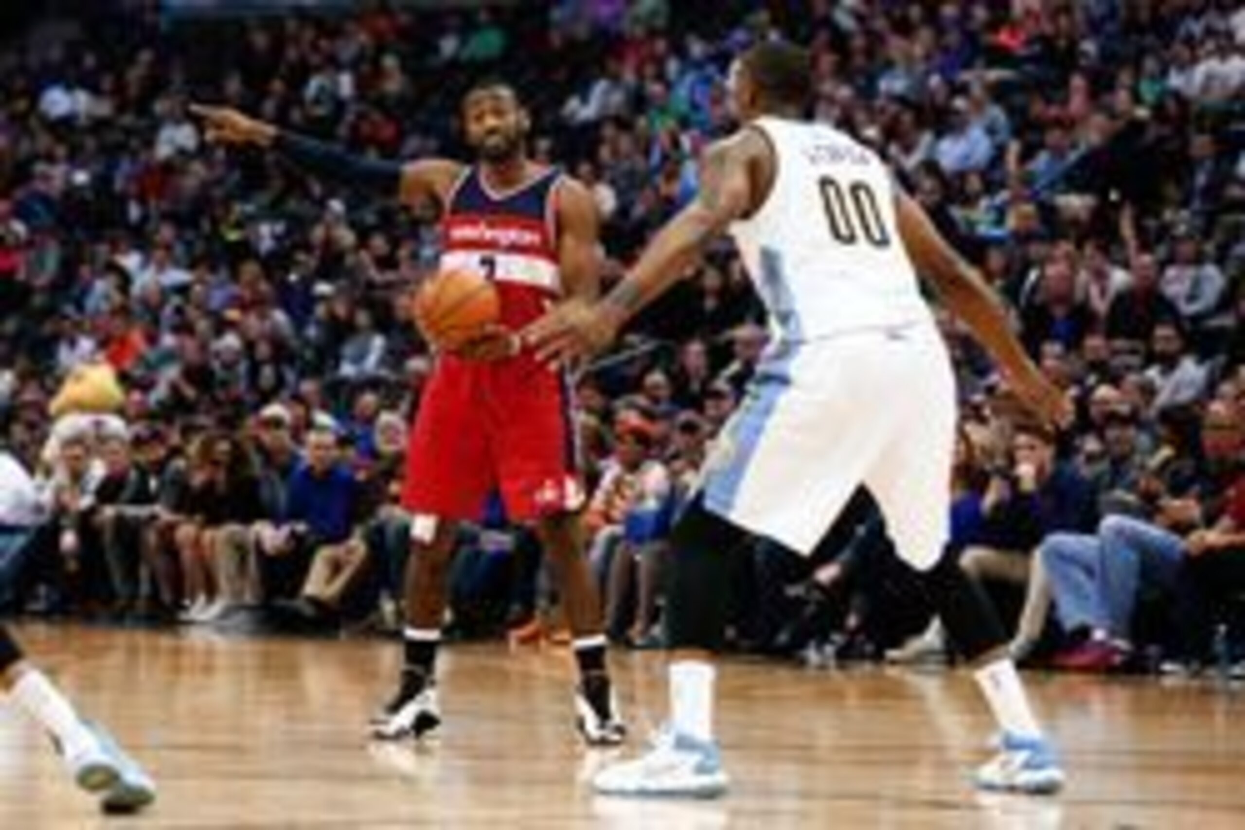 Mar 12, 2016; Denver, CO, USA; Washington Wizards guard John Wall (2) motions in the fourth quarter against Denver Nuggets forward Darrell Arthur (00) at the Pepsi Center. The Nuggets defeated the Wizards 116-100. Mandatory Credit: Isaiah J. Downing-USA T