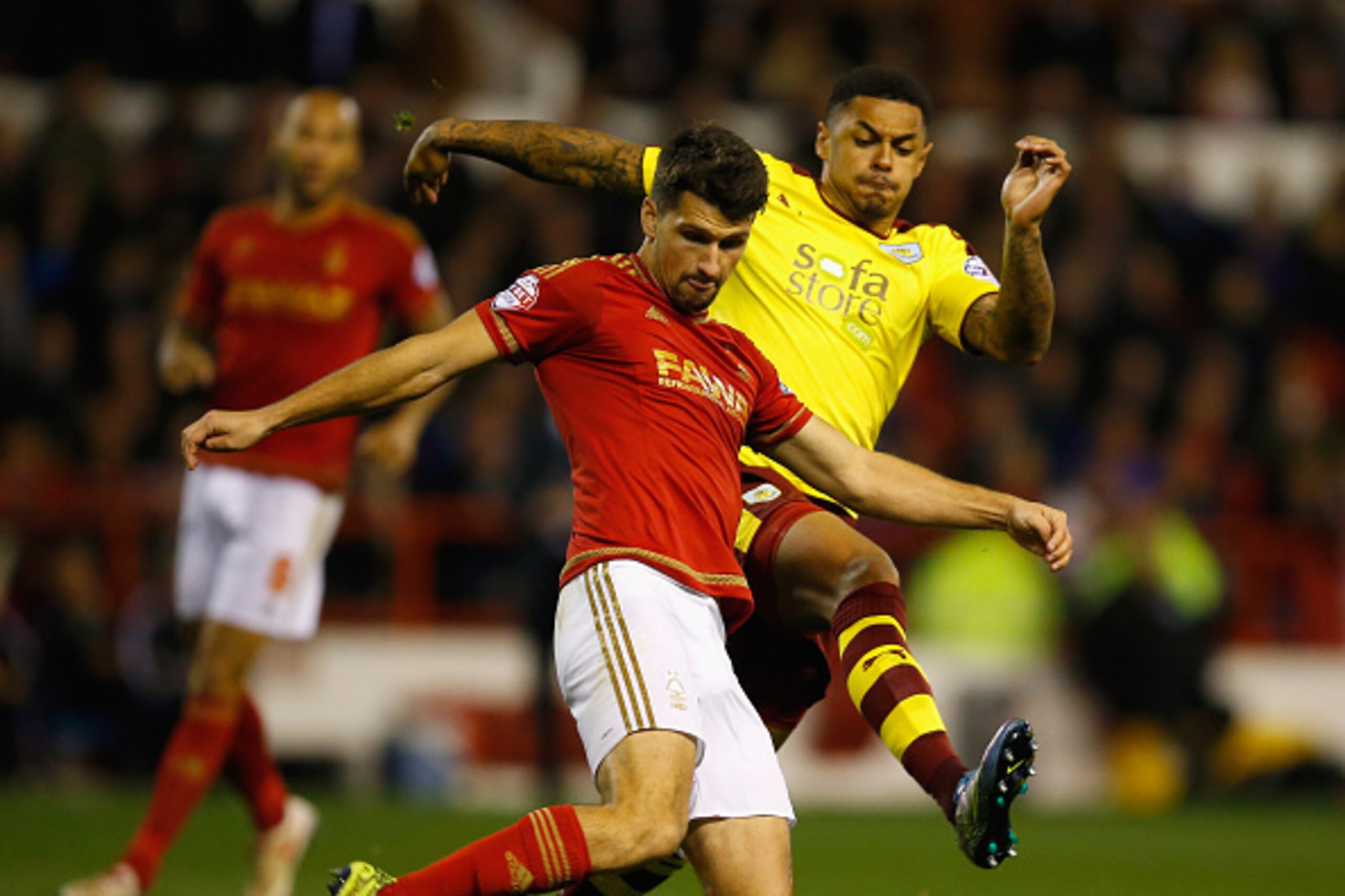 NOTTINGHAM, ENGLAND - OCTOBER 20: Eric Lichaj of Nottingham Forest clears from Andre Gray of Burnley during the Sky Bet Championship match between Nottingham Forest and Burnley at City Ground on October 20, 2015 in Nottingham, England.  (Photo by Laurence