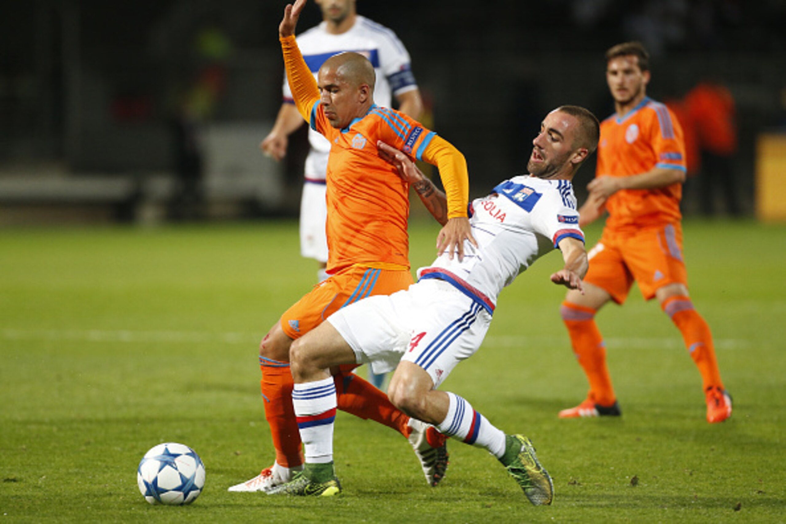 LYON, FRANCE - SEPTEMBER 29:  Sofiane Feghouli of Valencia CF is tackled by Sergi Darder of Lyon during the UEFA Champions league match between Olympique Lyonnais (OL) and Valencia CF at Stade de Gerland on September 29, 2015 in Lyon, France. (Photo by Je