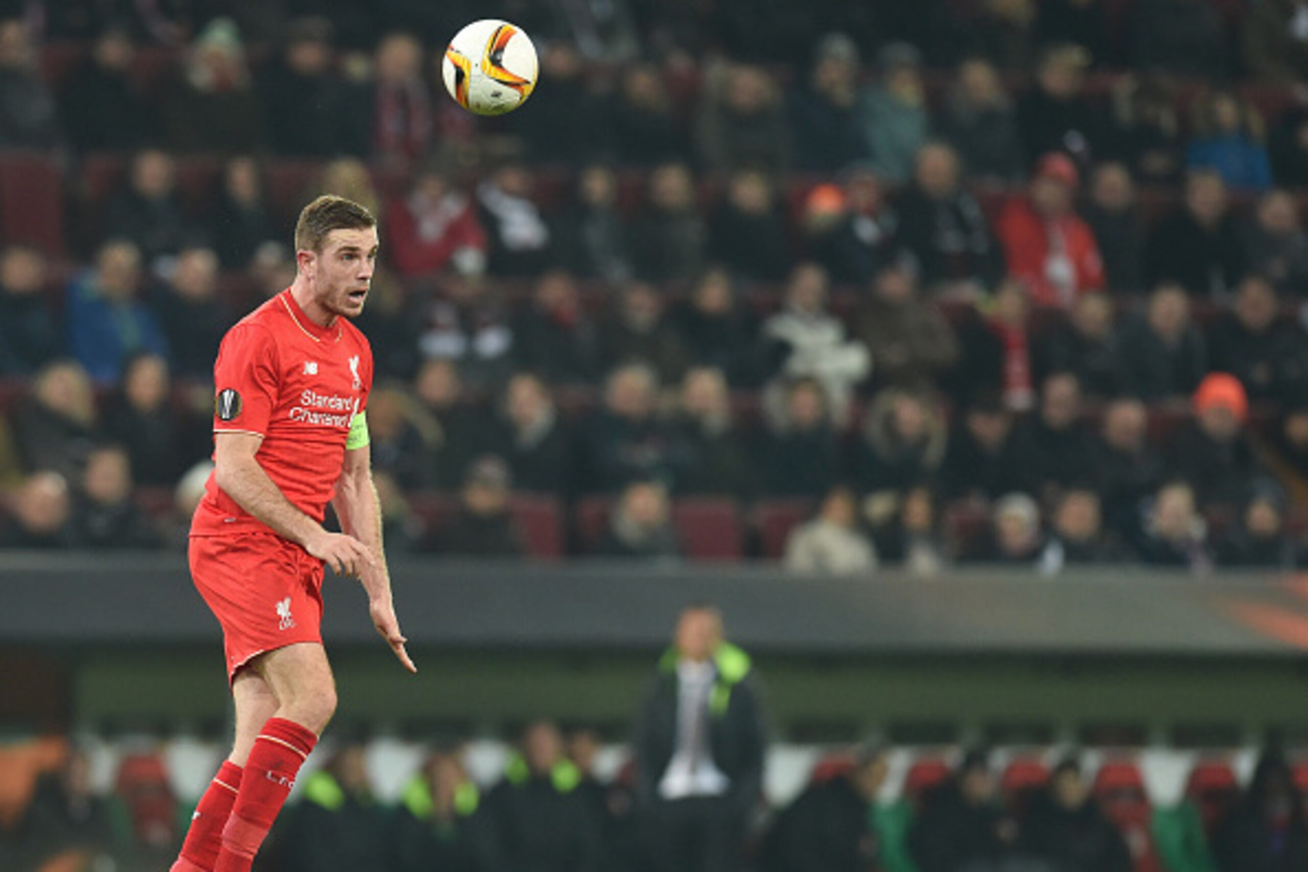 Liverpool's midfielder Jordan Henderson plays the ball during the UEFA Europa League Round of 32 football match between FC Augsburg and Liverpool FC in the stadium in Augsburg, southern Germany on February 18, 2016. 
 / AFP / Christof STACHE        (Photo