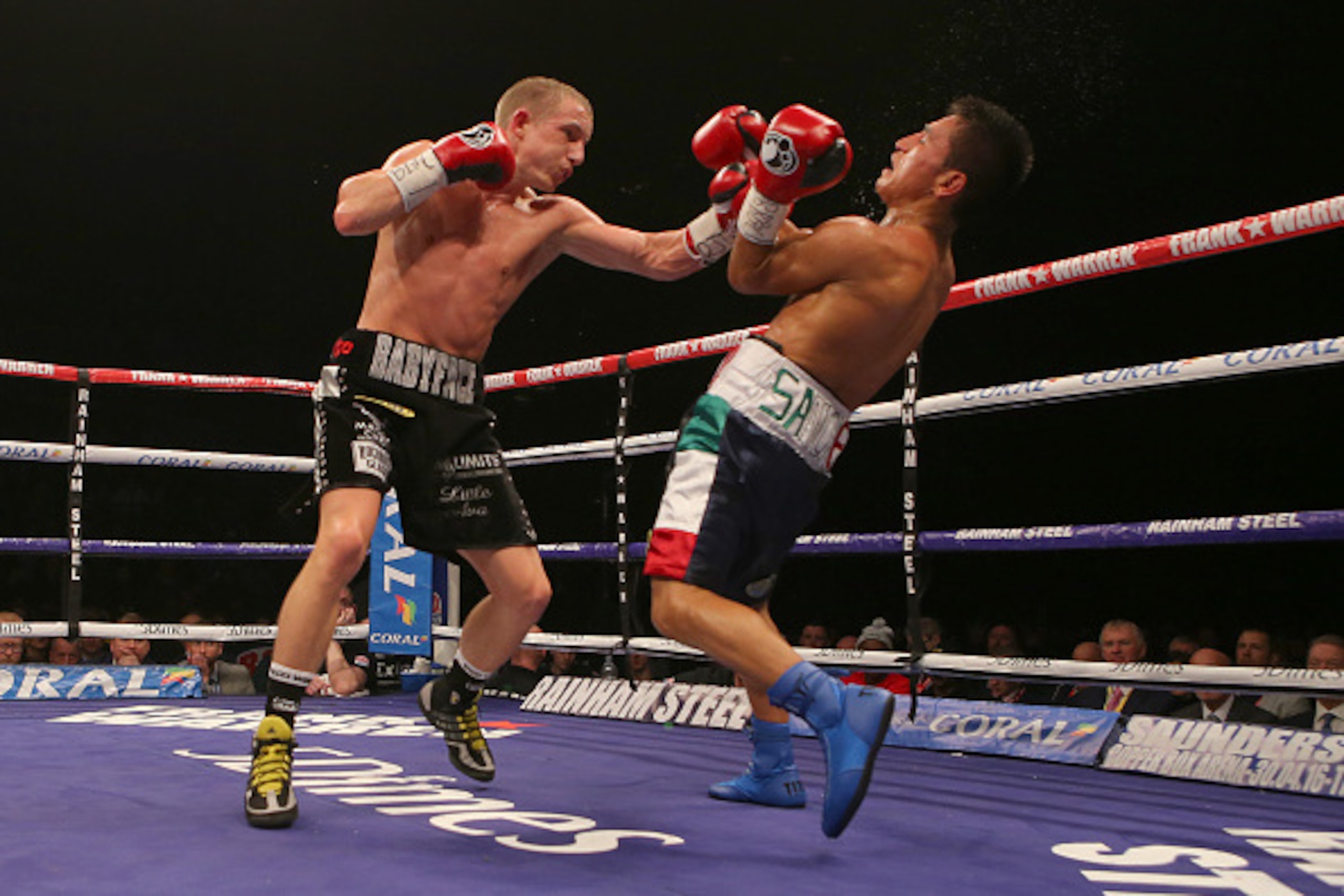 LIVERPOOL, ENGLAND - MARCH 12: Paul Butler and Sebastian Sanchez in action during their IBF International Super-Flyweight bout at the Echo Arena on March 12, 2016 in Liverpool, England. (Photo by Dave Thompson/Getty Images)