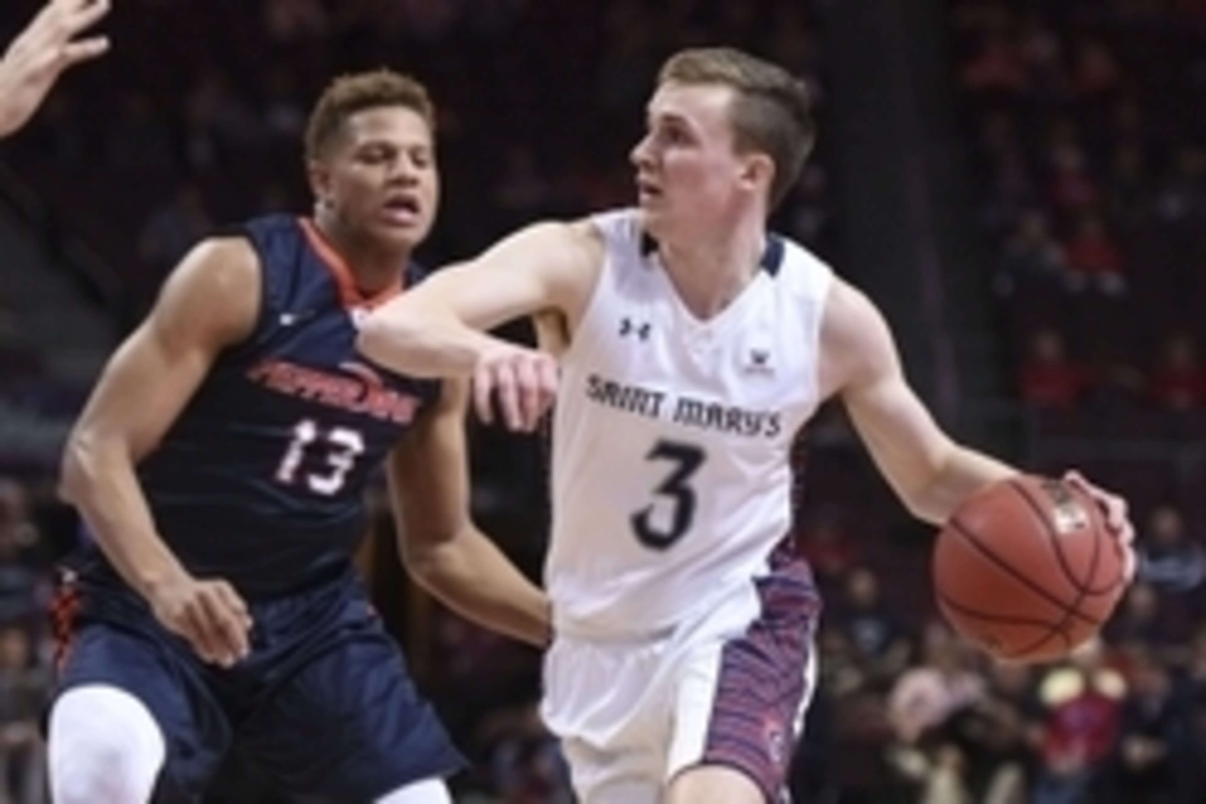 March 7, 2016; Las Vegas, NV, USA; Saint Mary's Gaels guard Emmett Naar (3) dribbles the basketball against Pepperdine Waves forward Kameron Edwards (13) during the first half in the semifinals of the West Coast Conference tournament at Orleans Arena. Man